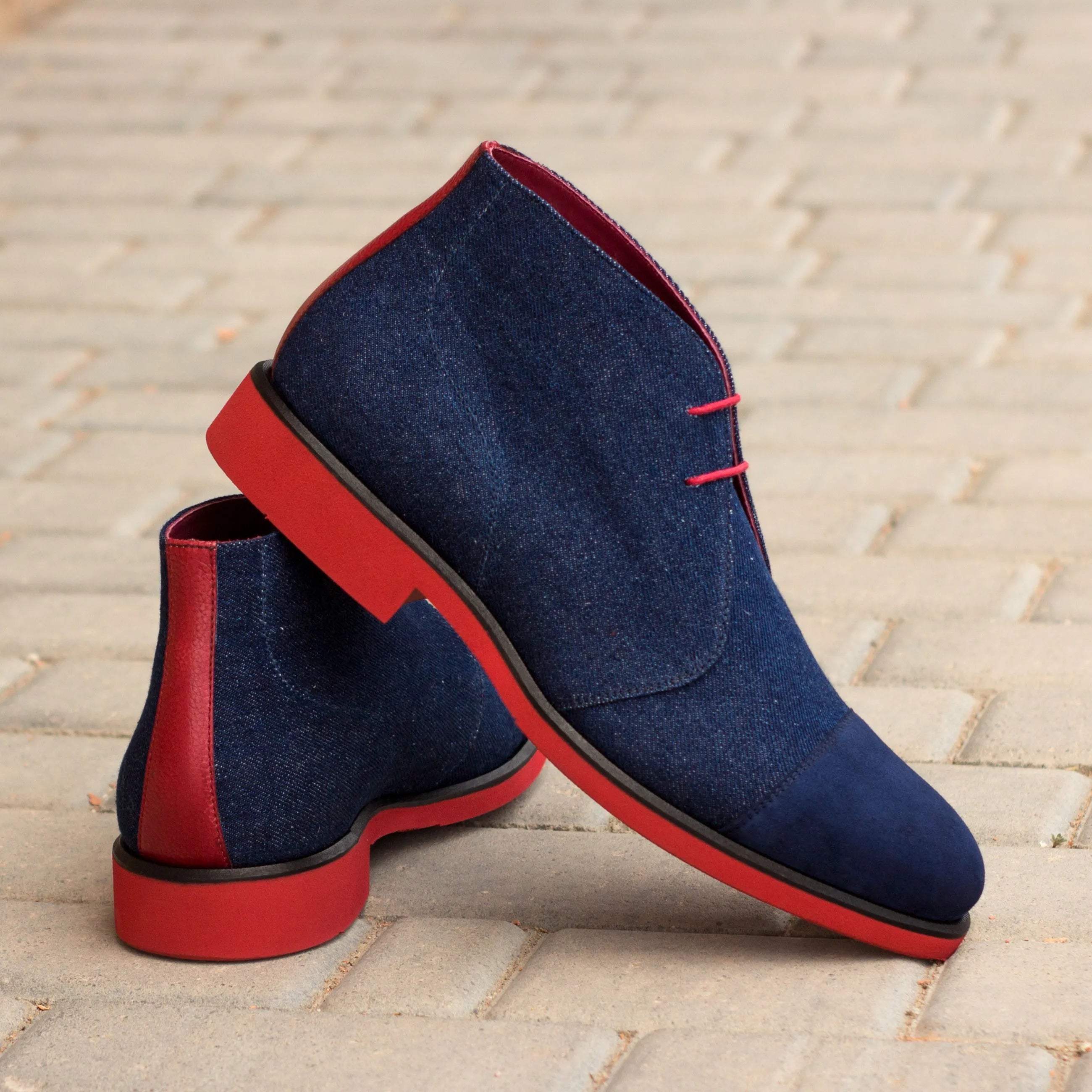 Blue denim Narek Chukkas with striking red soles for stylish footwear choices