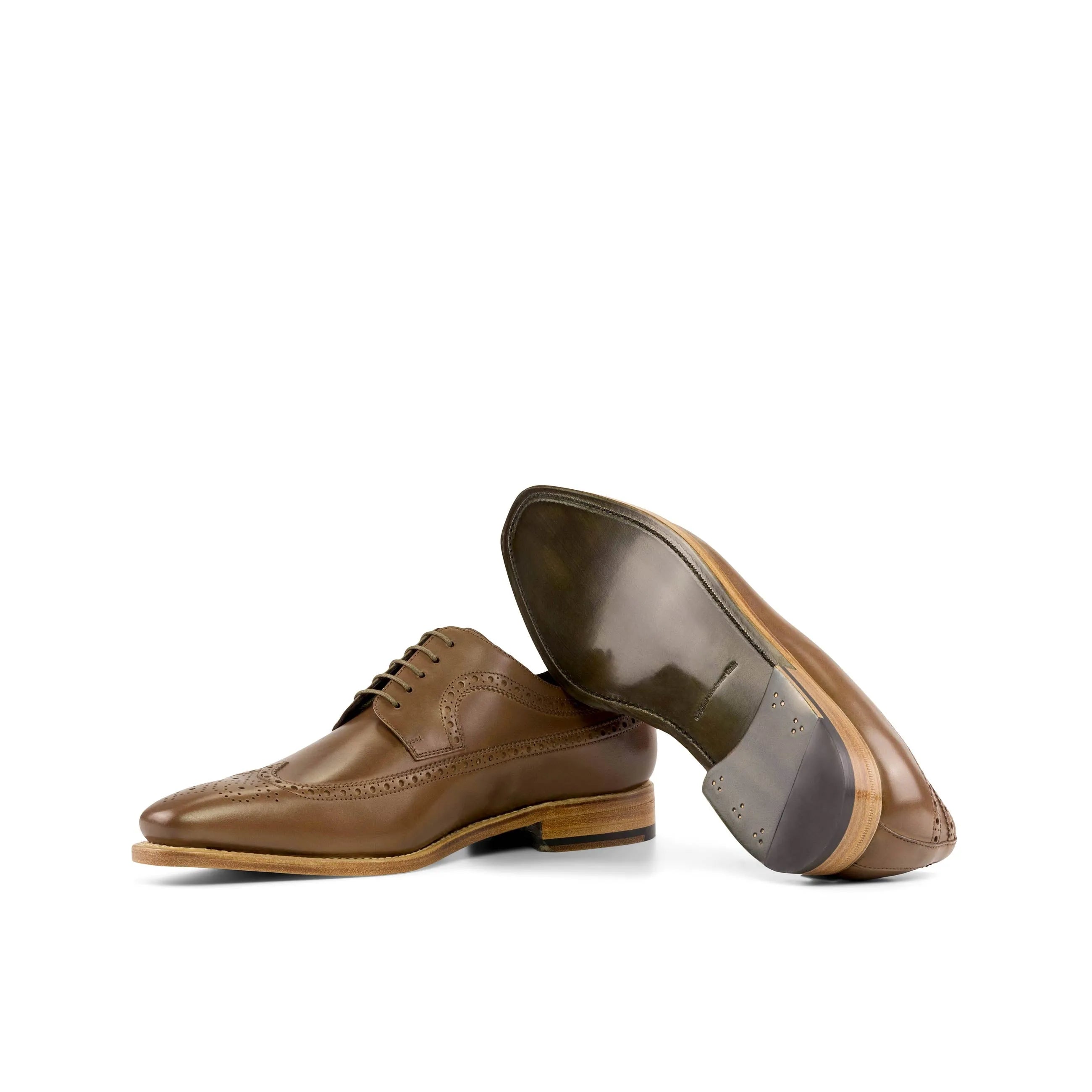 Pair of brown leather Norman Longwing Blucher shoes on a neutral background