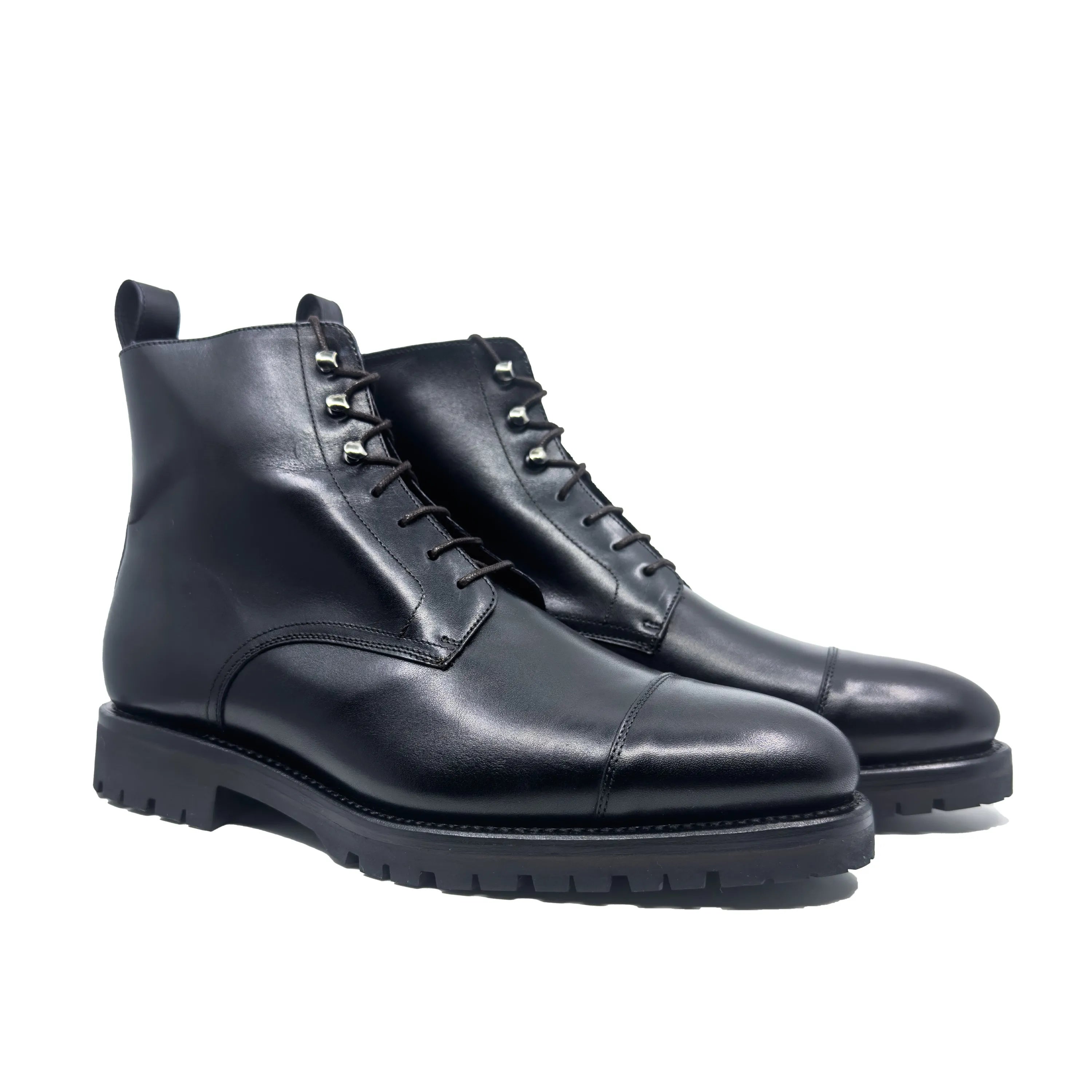 Stylish pair of black leather cap-toe jumper boots from Oakland 45, ideal for fast lane fashion