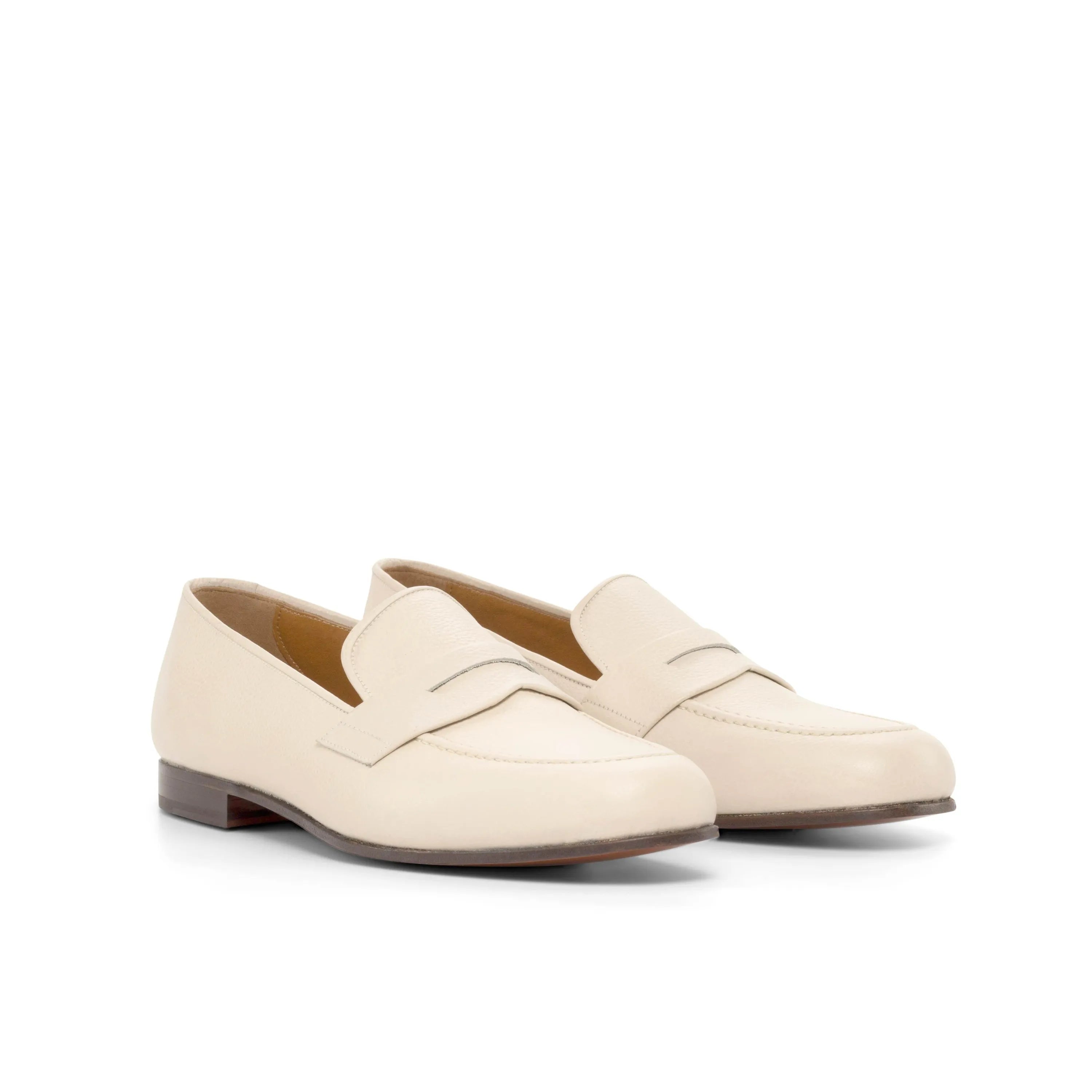 Cream-colored leather loafers from the Olgo Wellington slip collection