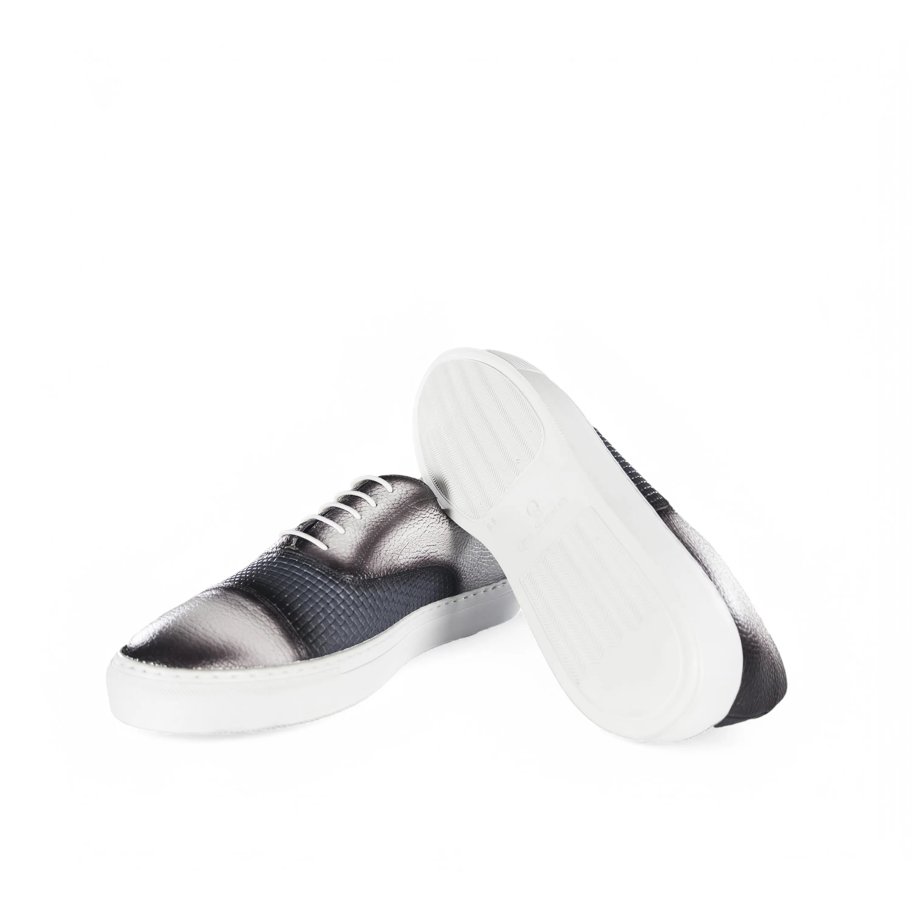 Stylish black and silver Olimpia Oxford Sneakers elegantly displayed for modern footwear
