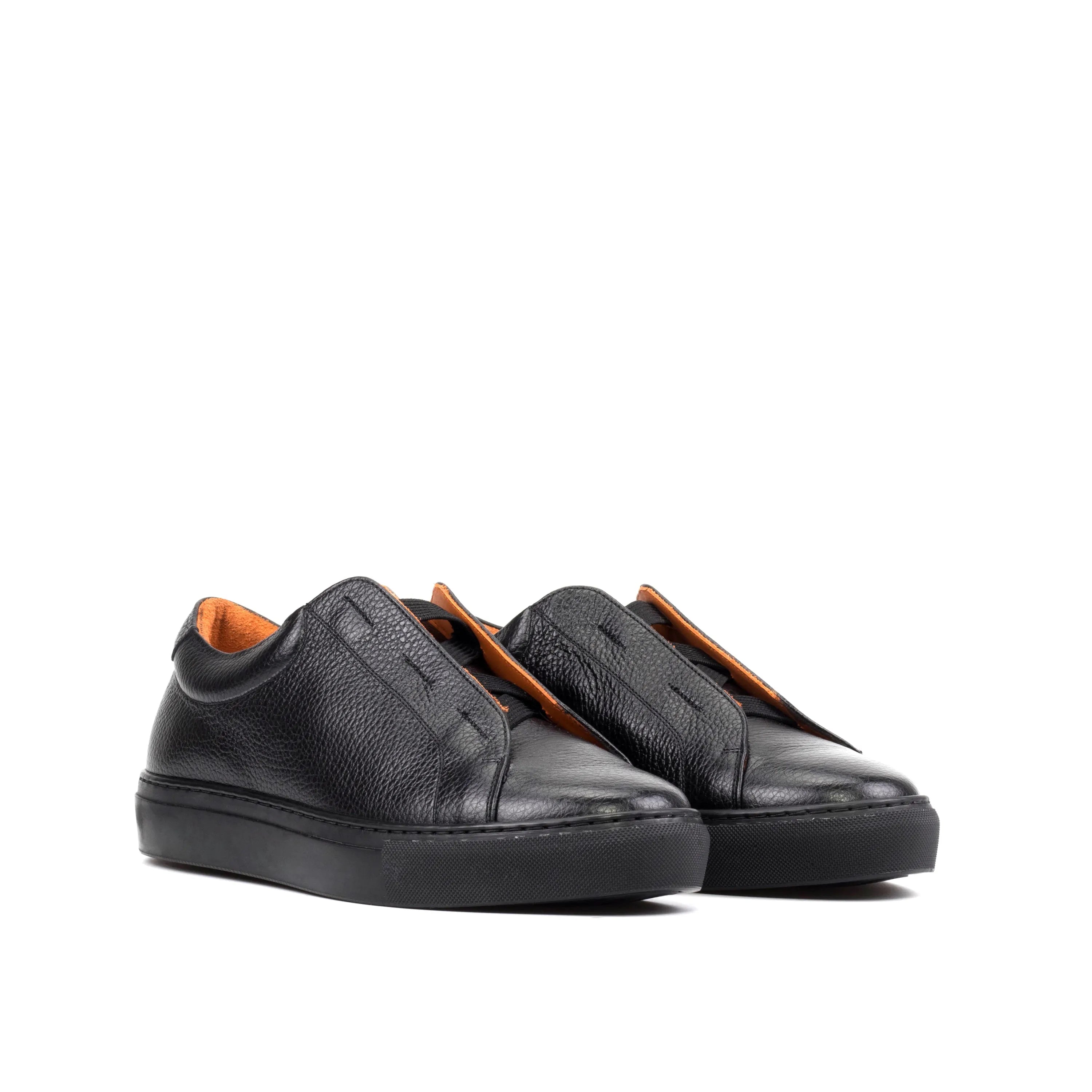 Black leather slip-on sneakers featuring the Ordogan Laceless Sneaker II design