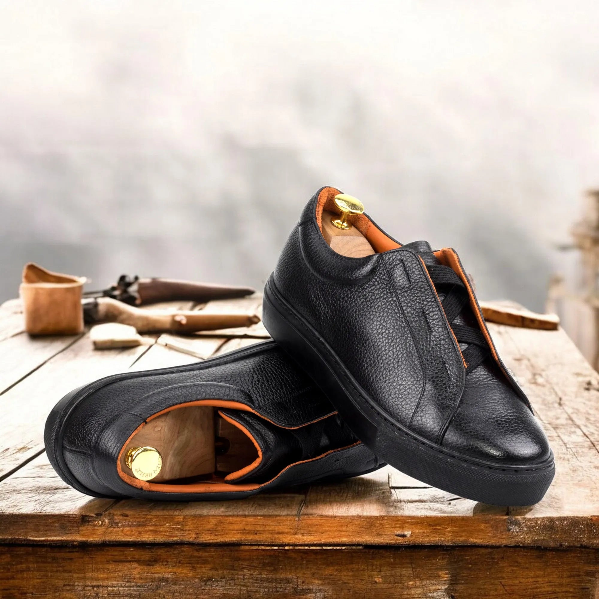 Pair of black leather slip-on Ordogan Laceless Sneakers for stylish comfort and convenience