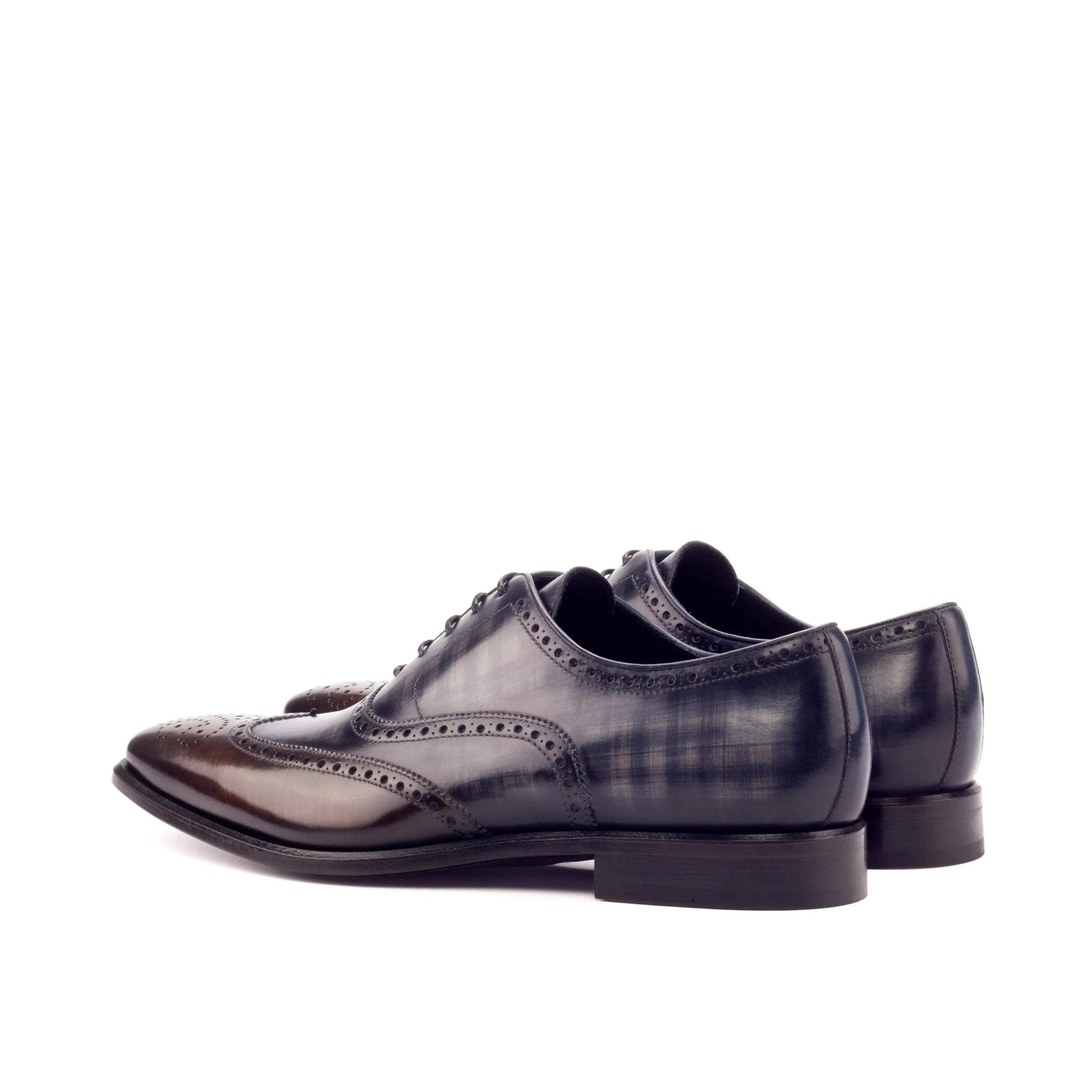 Dark leather dress shoes featuring Owens Full Brogue Patina for sophisticated style