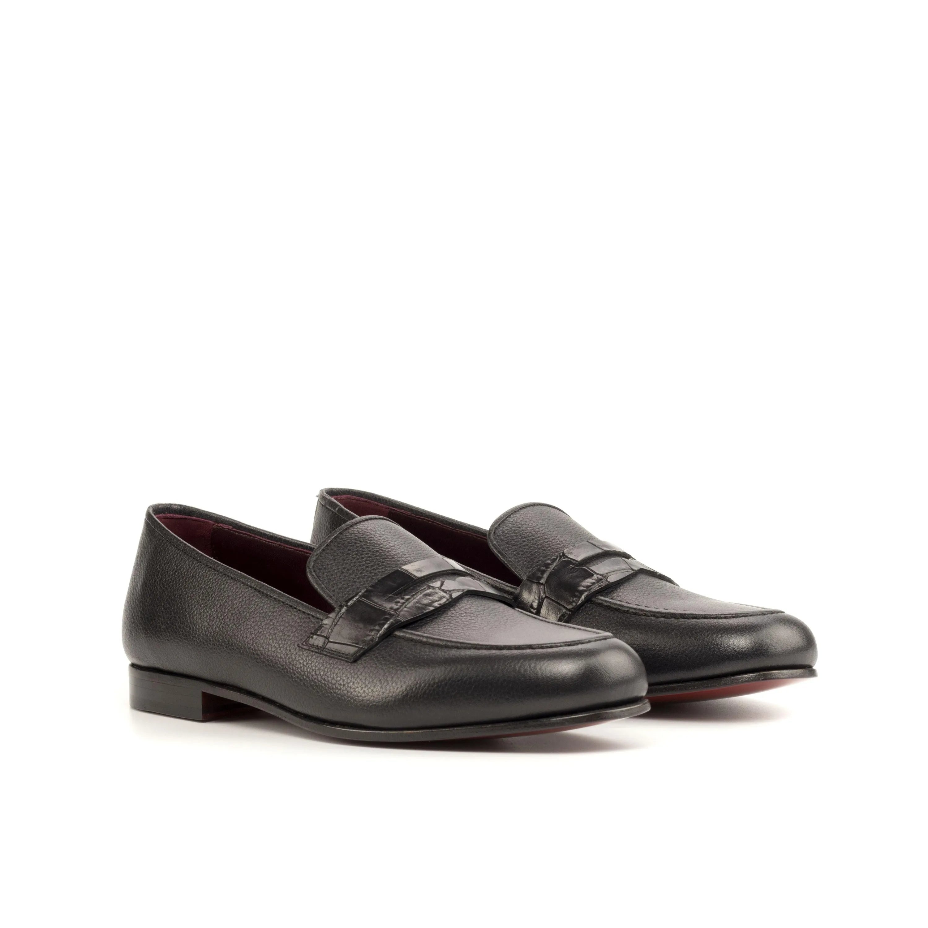 Pair of black leather loafers, showcasing the Patron Wellington slip on design