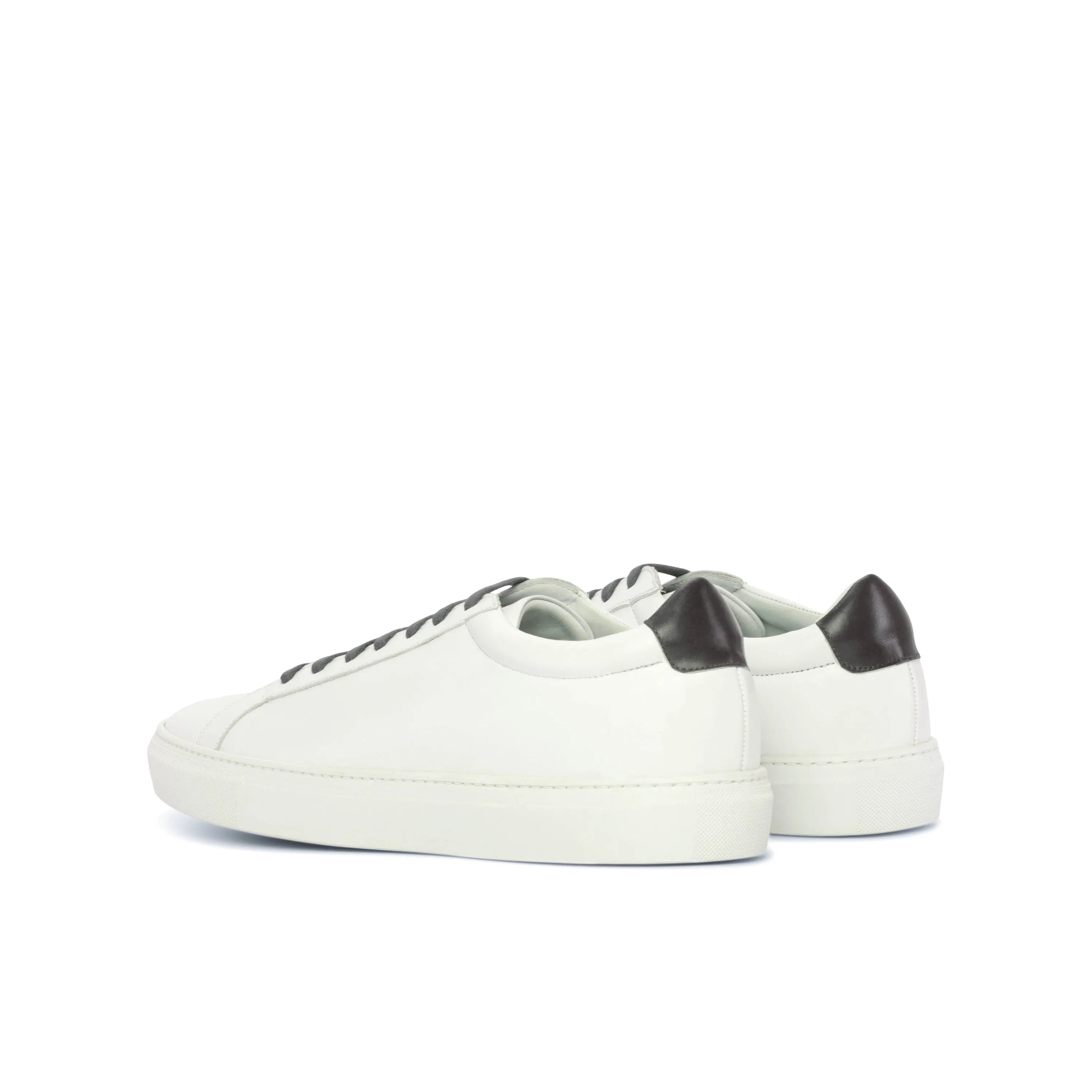White leather Pauli Low Kick sneakers showcased in a stylish fast lane design