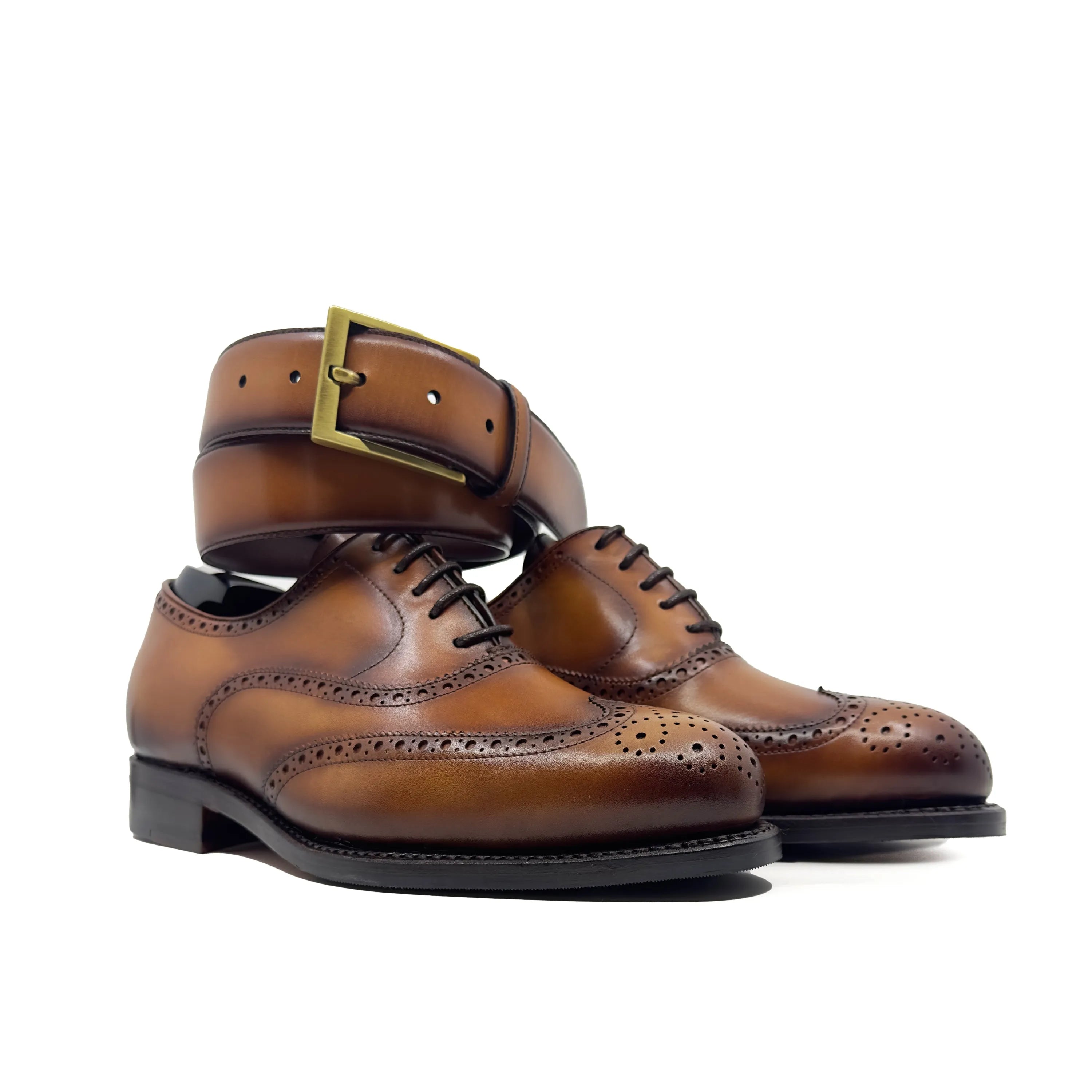 Brown leather wingtip dress shoes and matching belt from Pawl, perfect brogue shoes for the fast lane