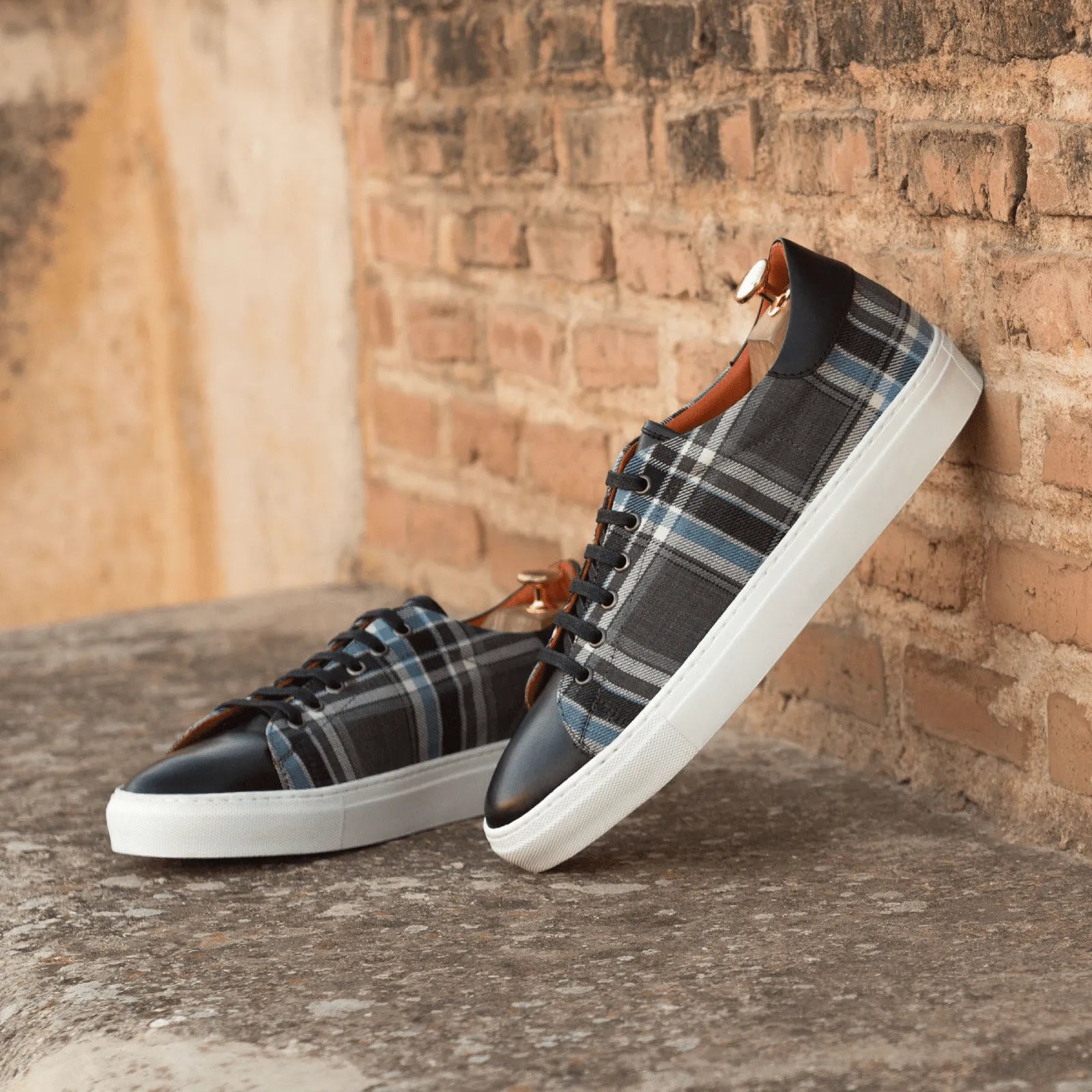 Plaid patterned leather Pele Trainer Sneaker II offering stylish comfort in footwear