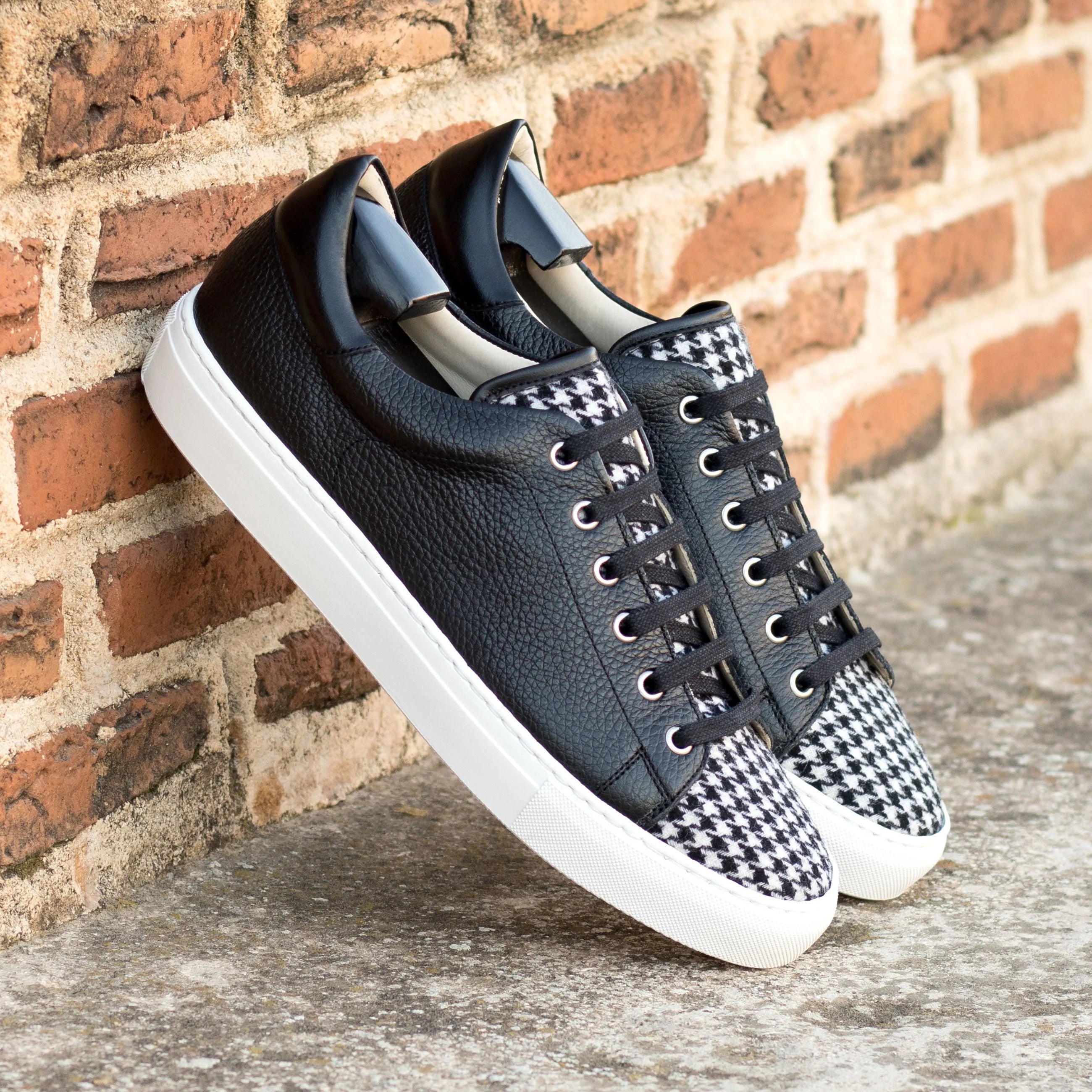 Black and white houndstooth Polando Trainer Sneaker displayed prominently