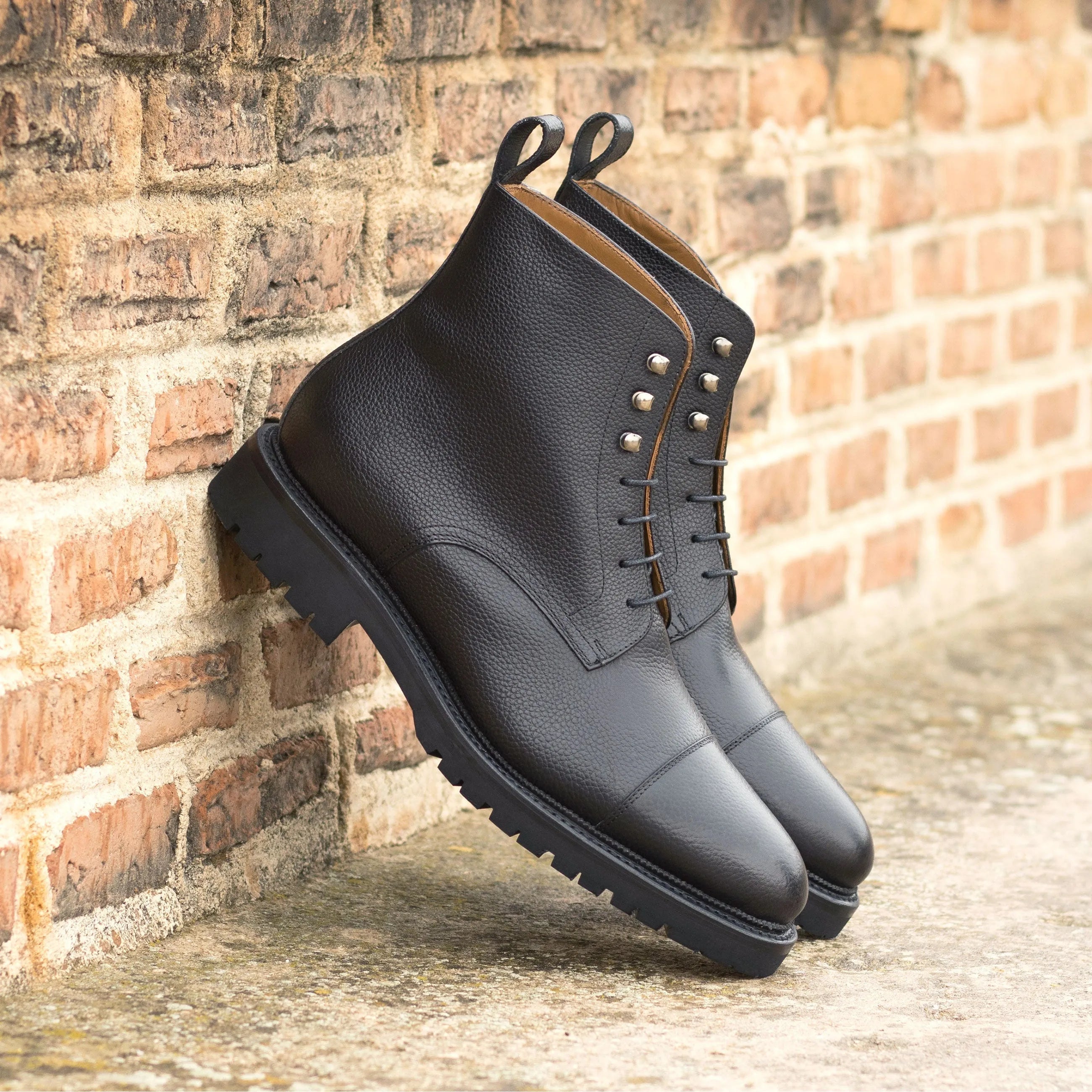 Black leather lace-up Primus Jumper Boots featuring a stylish and durable design