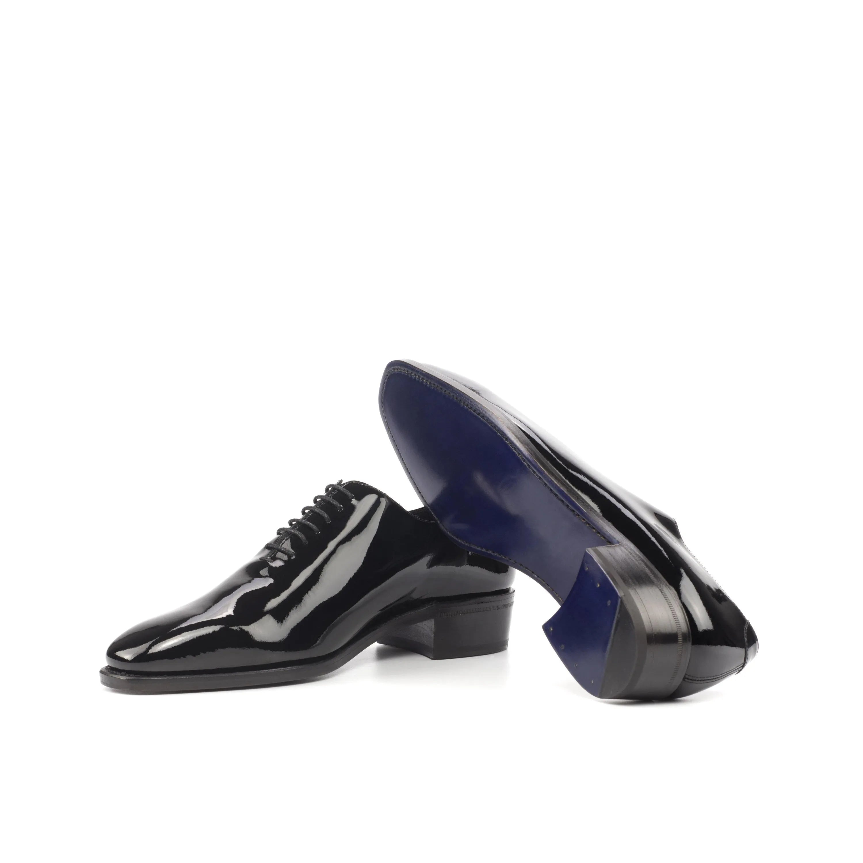 Shiny black Proper Wholecut shoes showcasing elegance and sophistication in footwear design