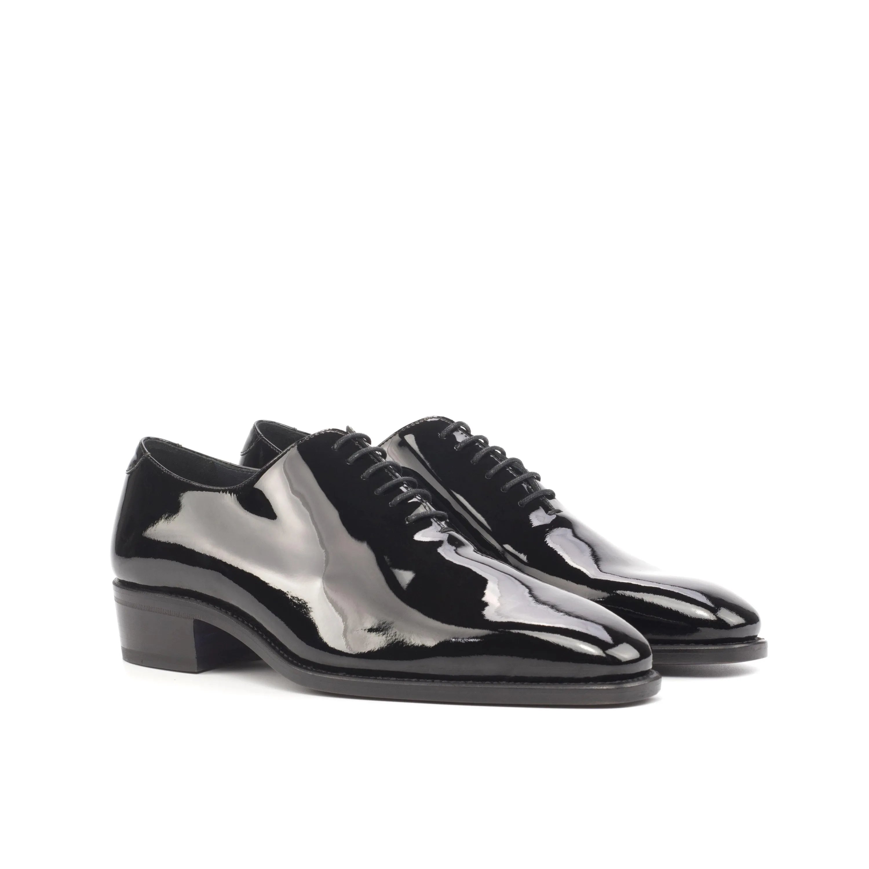 Pair of shiny black Proper Wholecut shoes designed for a sophisticated look