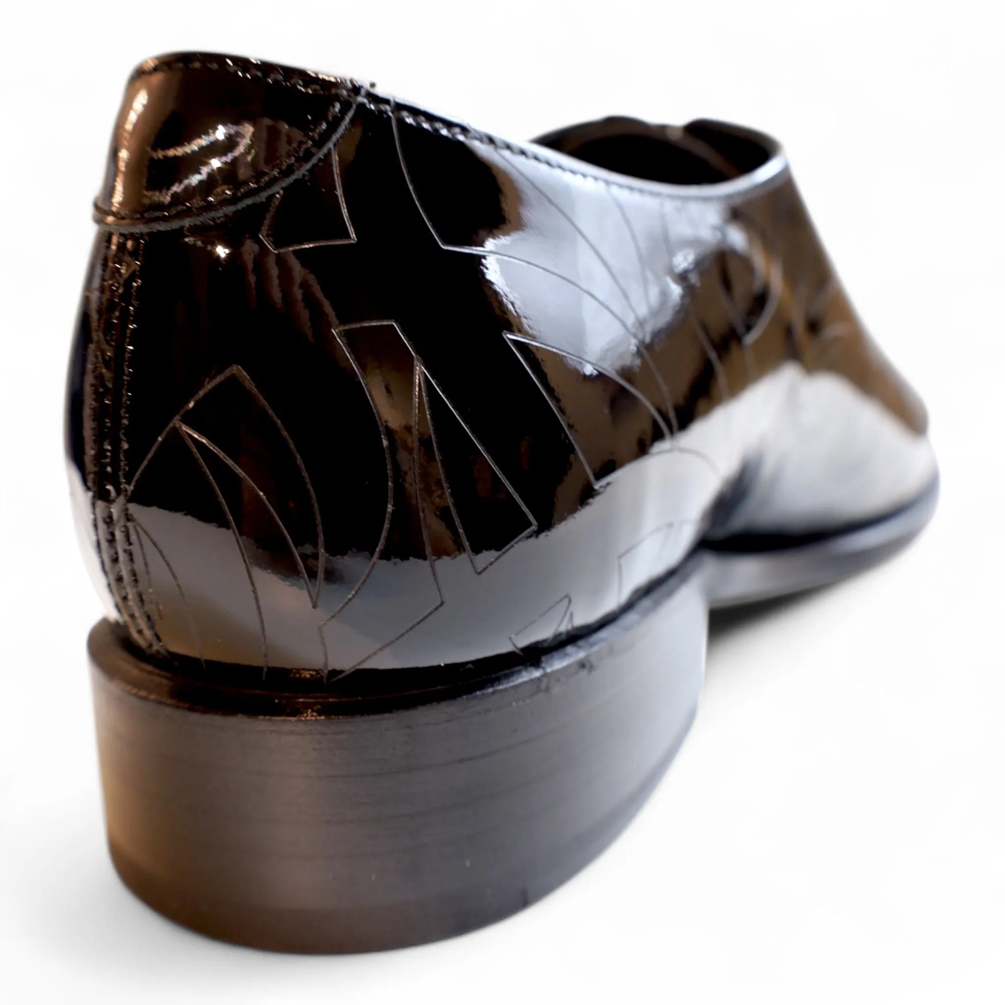 Shiny black Quswa Noir Wholecut Shoes from the Cleopatra Edition for elegant styling