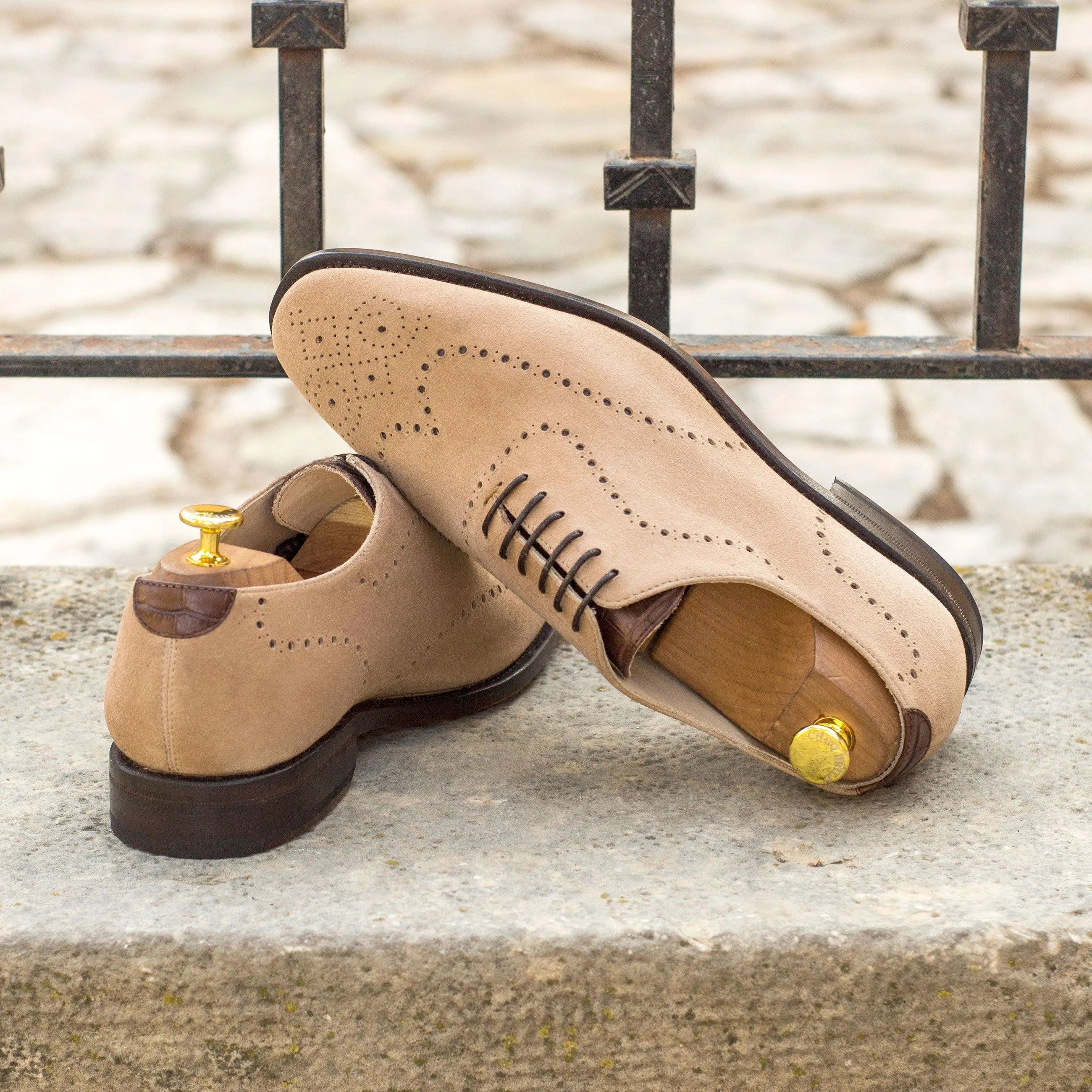 Tan suede wingtip dress shoes from Remod Wholecut, a luxury bespoke shoe for men
