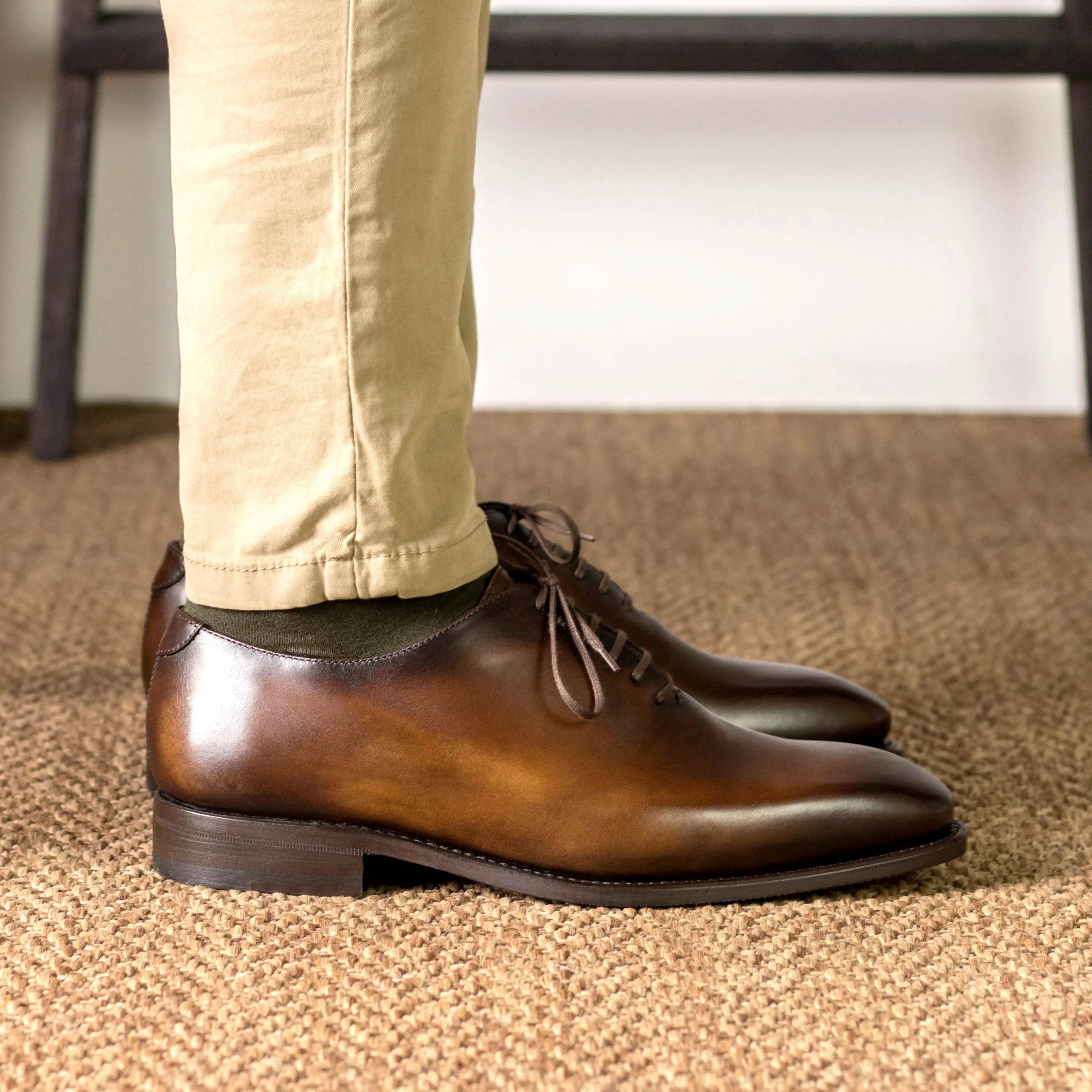 Brown leather Renzo Wholecut shoes showcasing elegance and timeless style