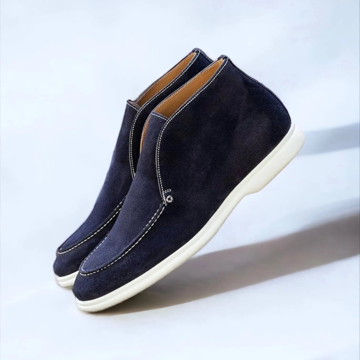 Pair of navy suede chukka boots featuring Riyadh Moc Flex sport design