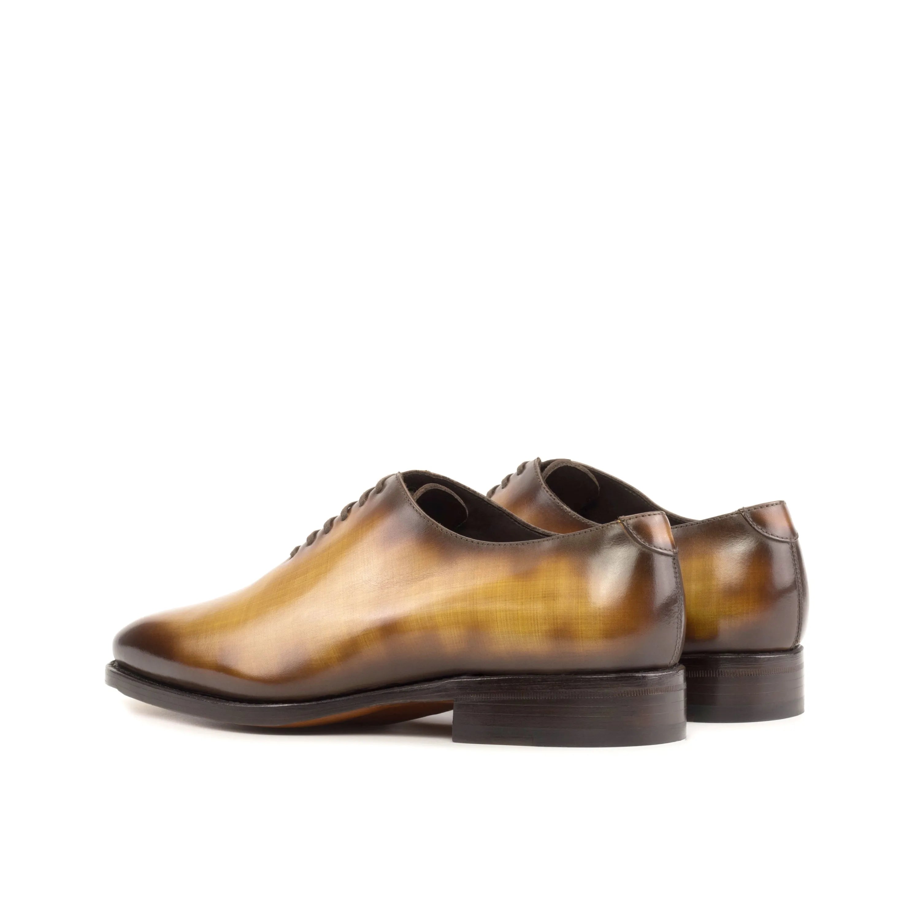 Leather dress shoes featuring a rich Rosewood Patina in a Wholecut design