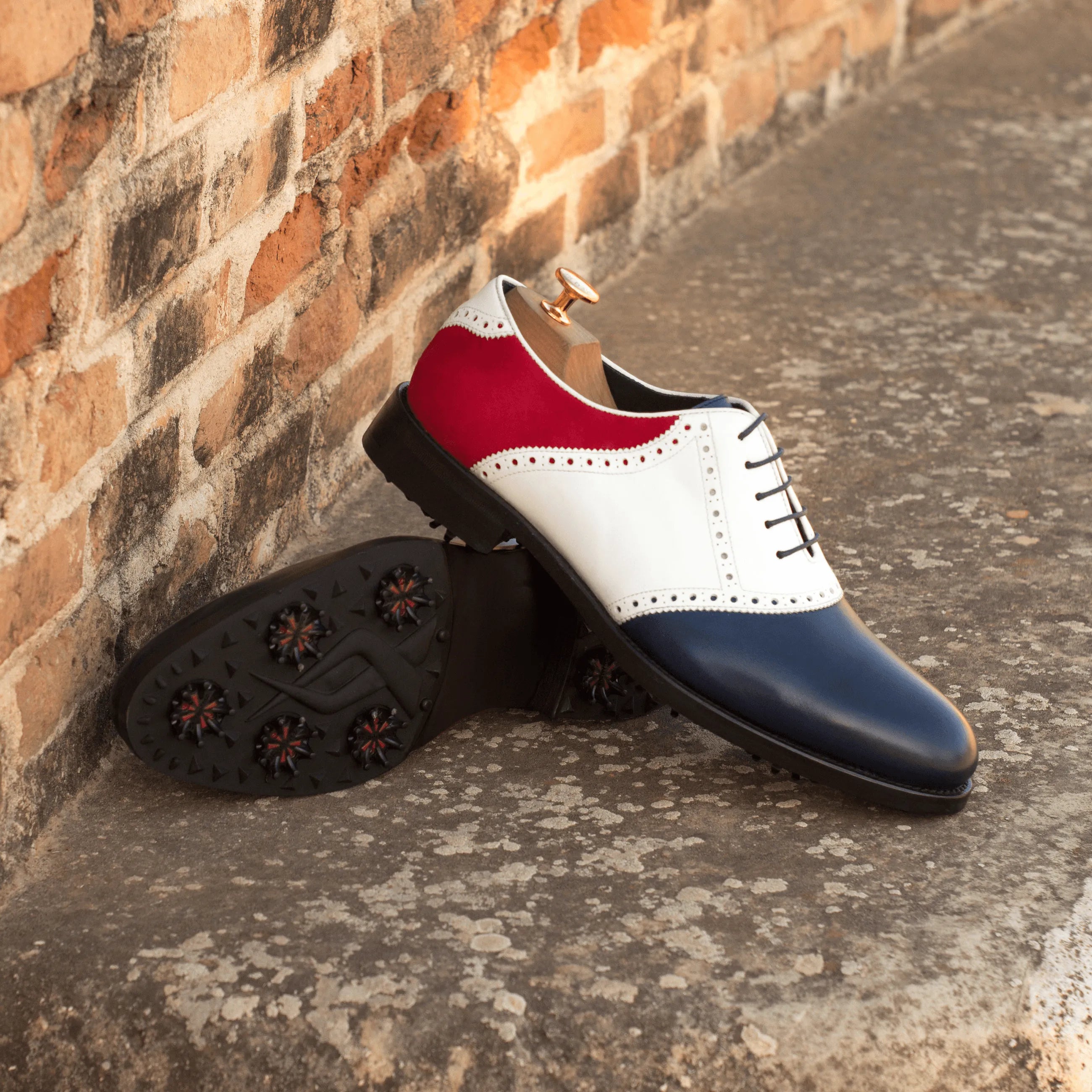 Tricolored Rotimi Saddle Golf Shoes II featuring a stylish rounded toe design