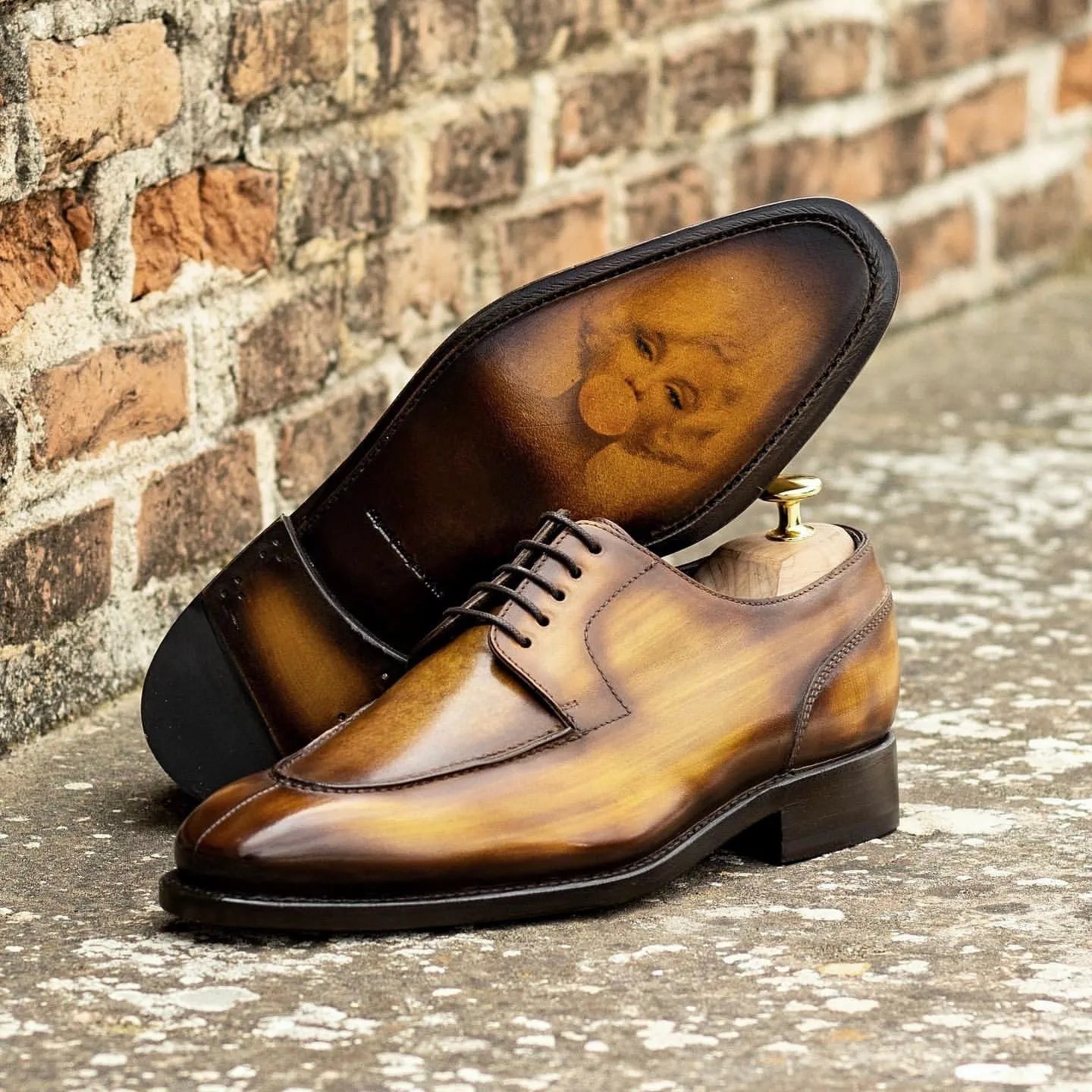 Brown leather Rubis Derby Split Toe Patina Shoes II showcasing elegant split toe patina design