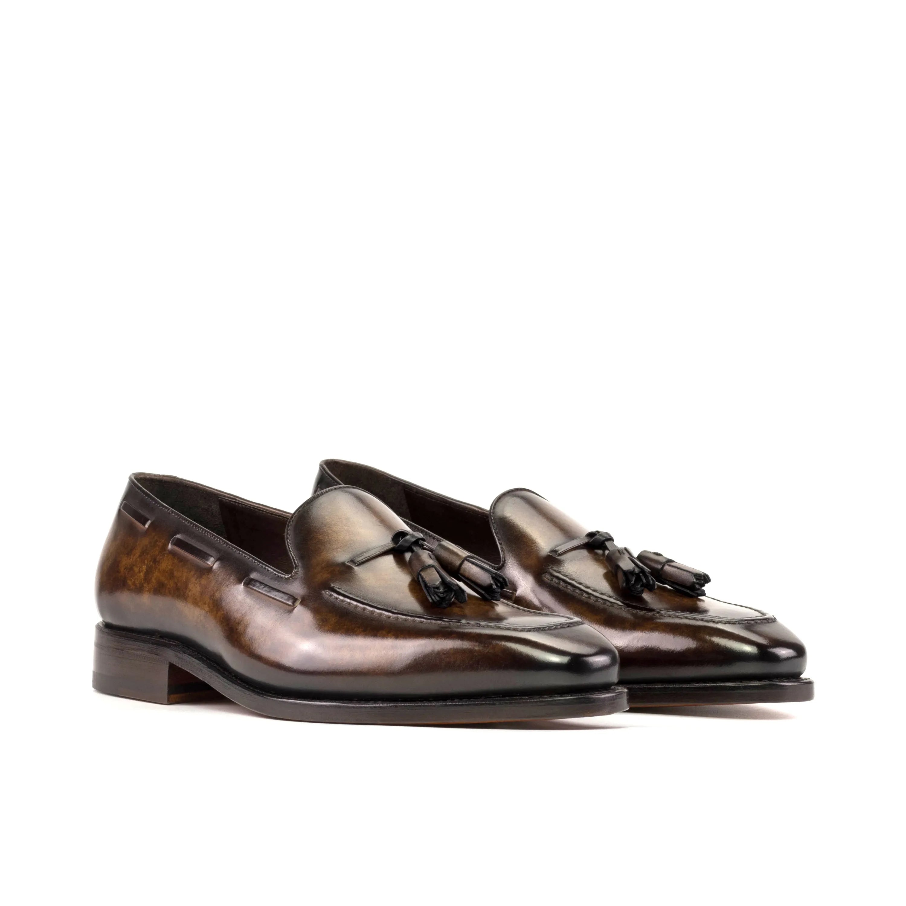 Pair of brown leather Sam Patina Loafers featuring stylish tassels for sophisticated attire