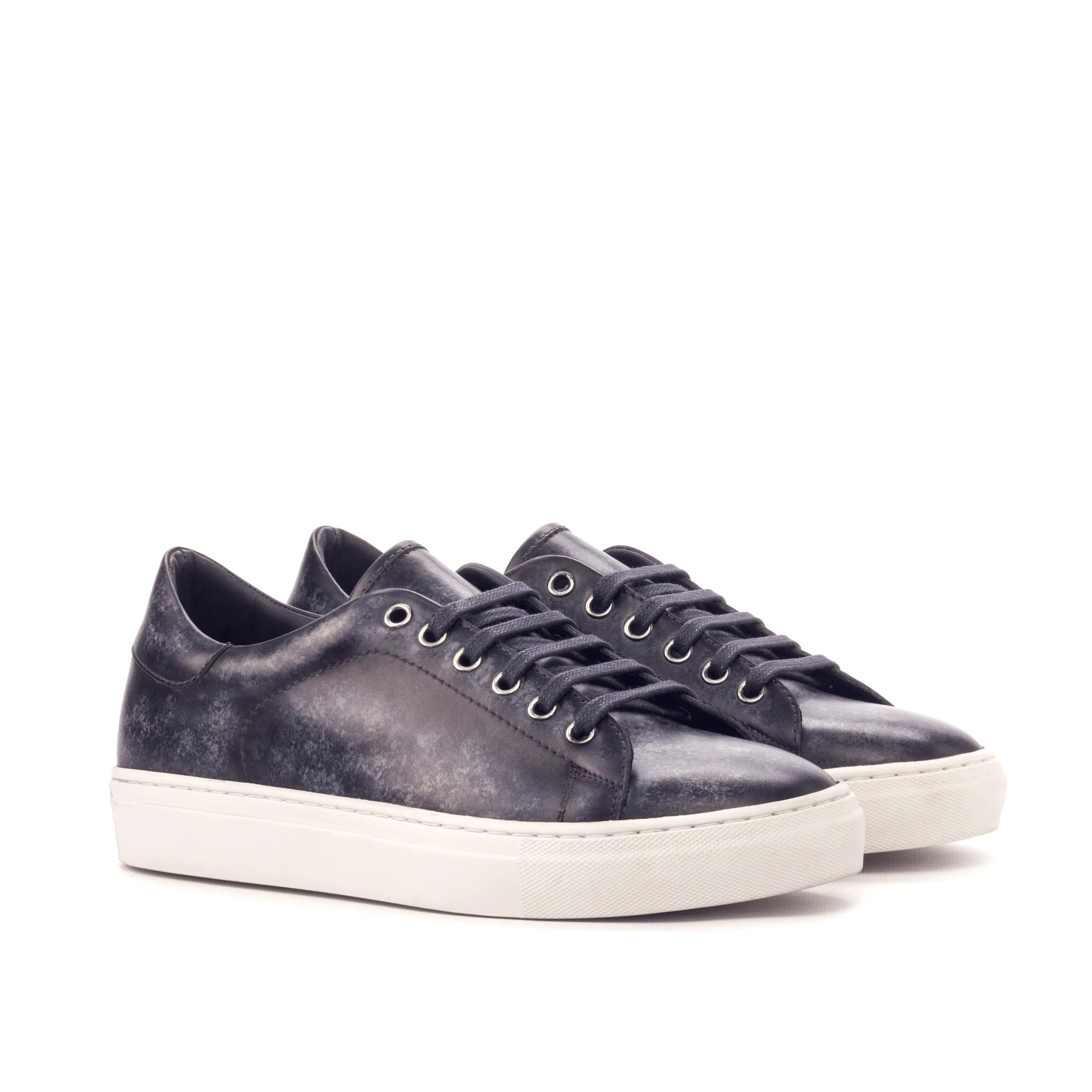 Pair of black leather Sancho Trainer Patina Sneakers with cupsole design