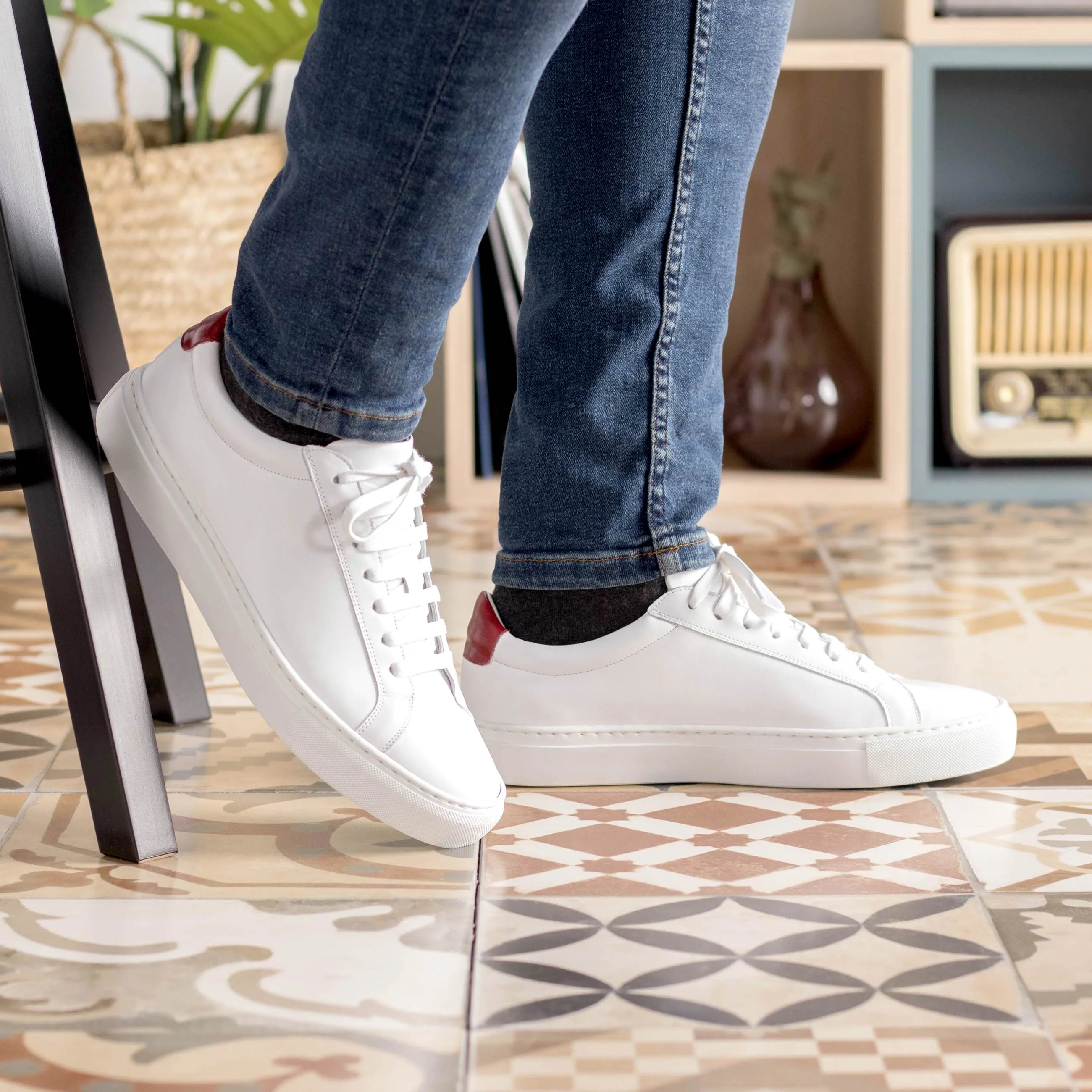 White leather Sima Low Kick sneakers displayed for stylish and comfortable footwear in the fast lane