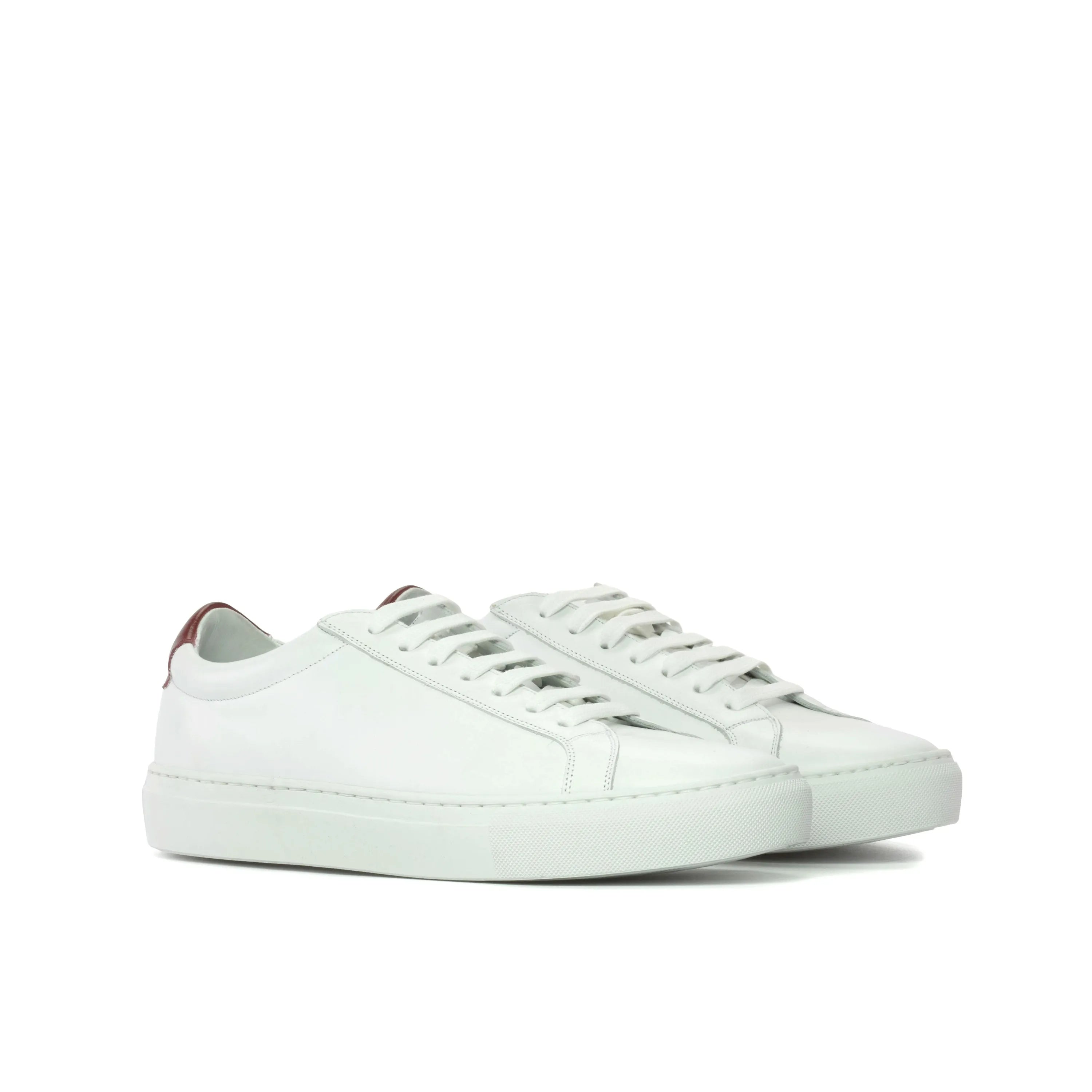 White leather Sima Low Kick Sneakers showcasing a modern and stylish design for fast lane fashion