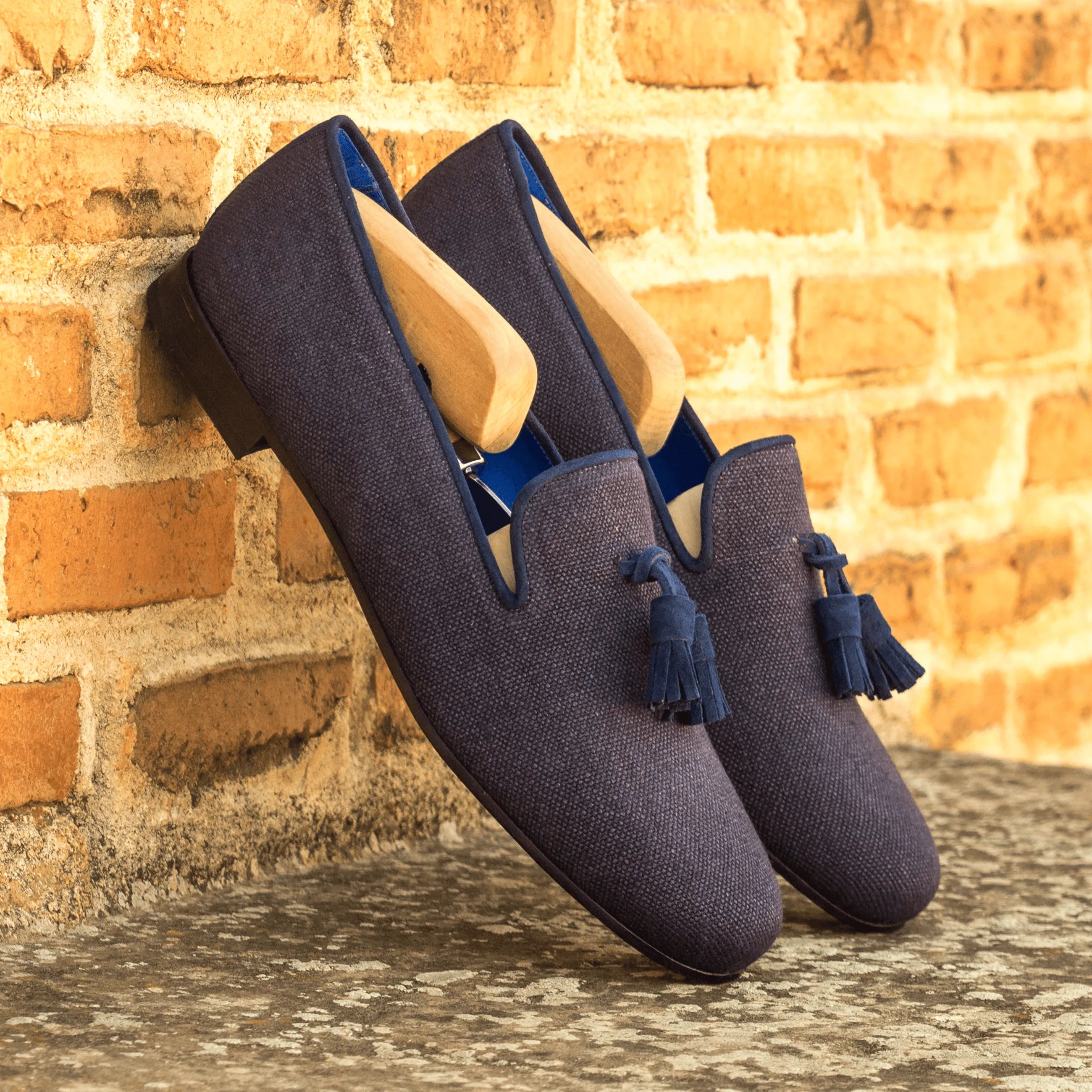 Navy kid suede Sina Wellington Slipon II featuring elegant tassel loafers design