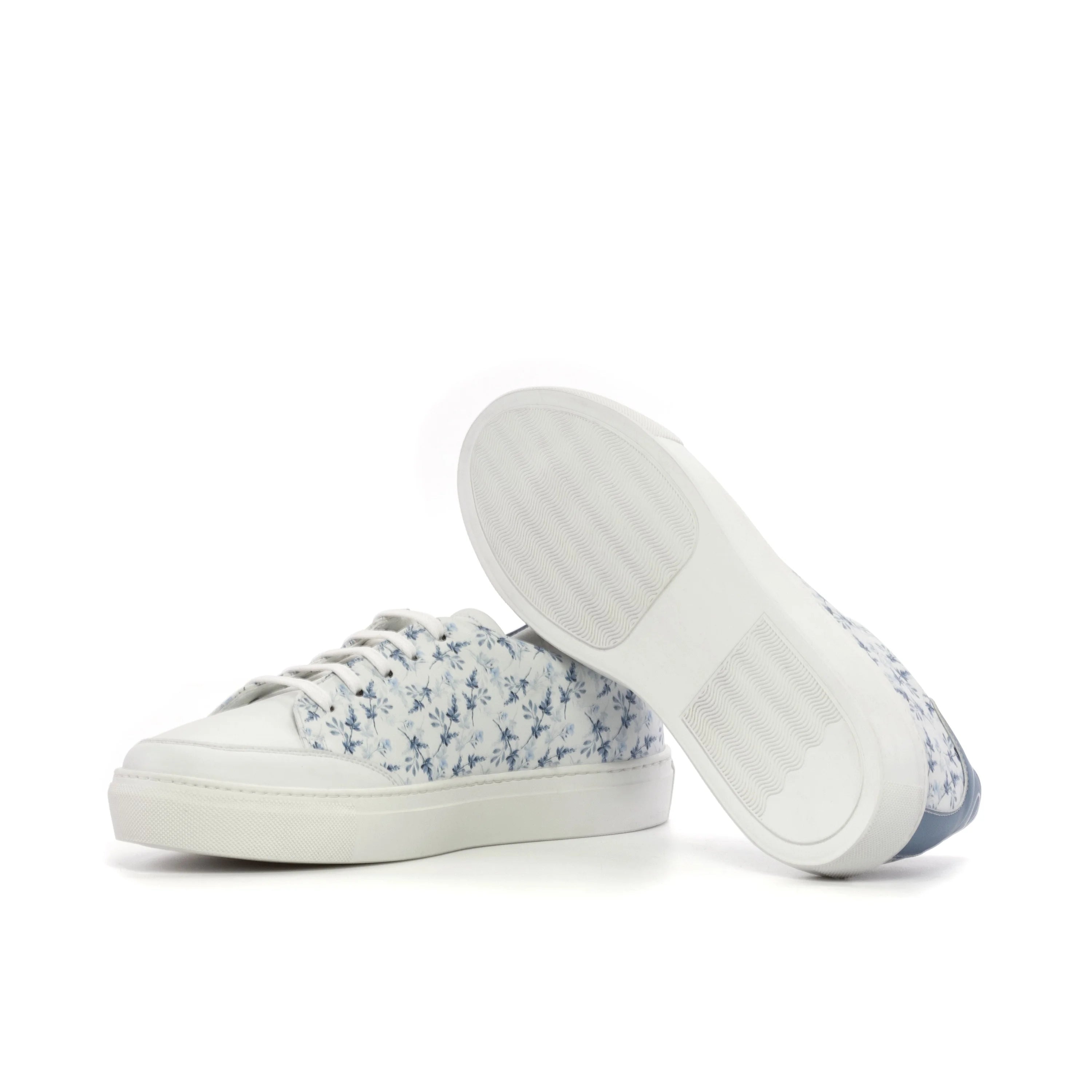 Solarisa unisex trainer: white low-top sneakers with blue floral pattern