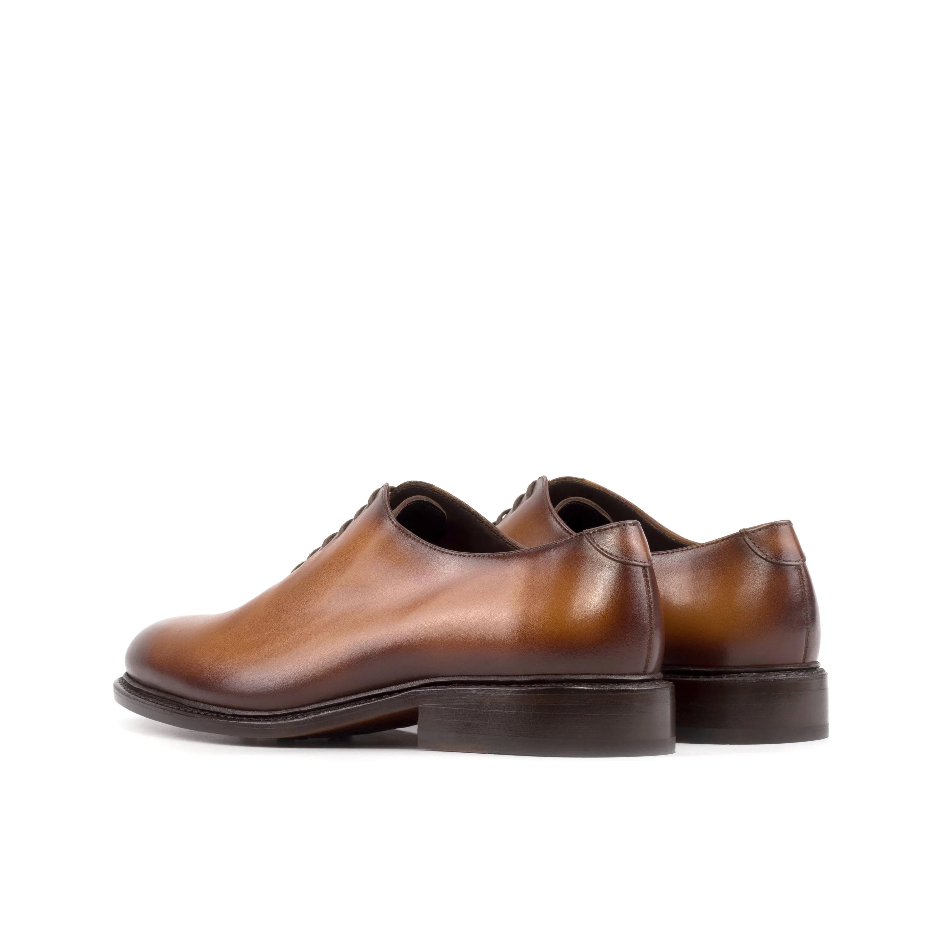 Brown leather Stellar Wholecut shoes showcasing elegant design and superior craftsmanship