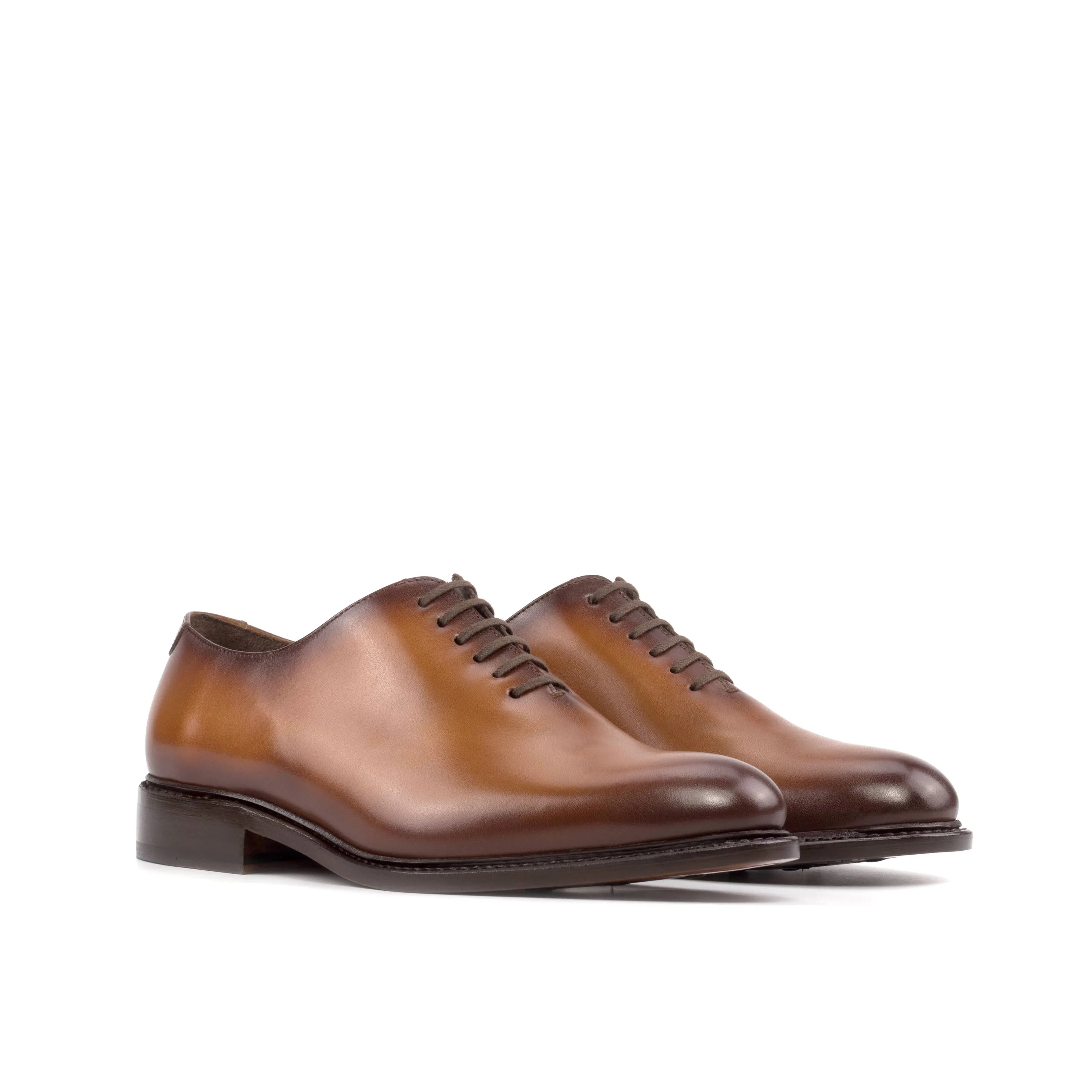Brown leather Stellar Wholecut shoes showcasing elegant craftsmanship and style