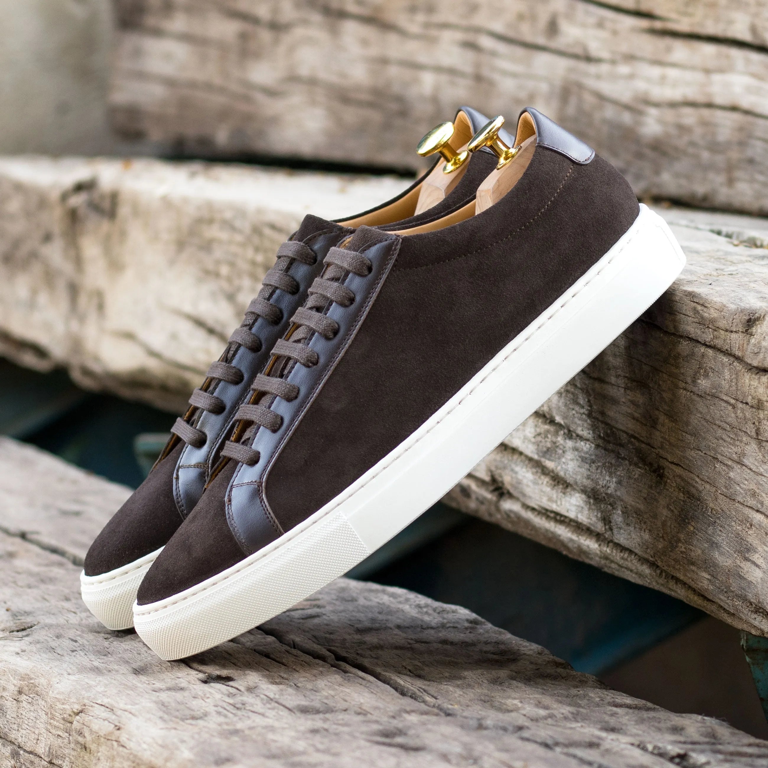 Brown suede Sterling Low Kick Sneakers, a stylish choice for casual footwear