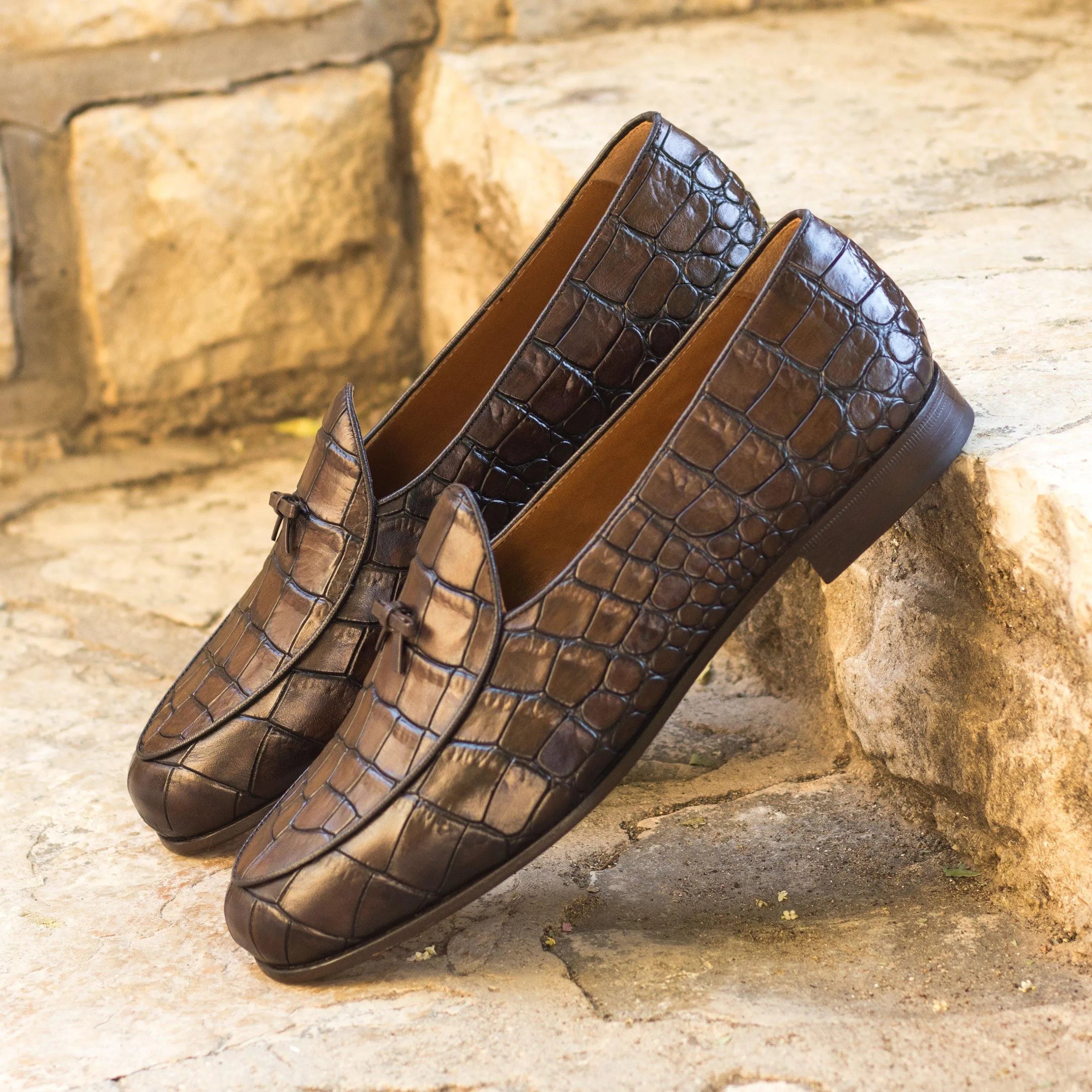 Brown crocodile-patterned leather loafers from St. John’s Belgian Slipper collection