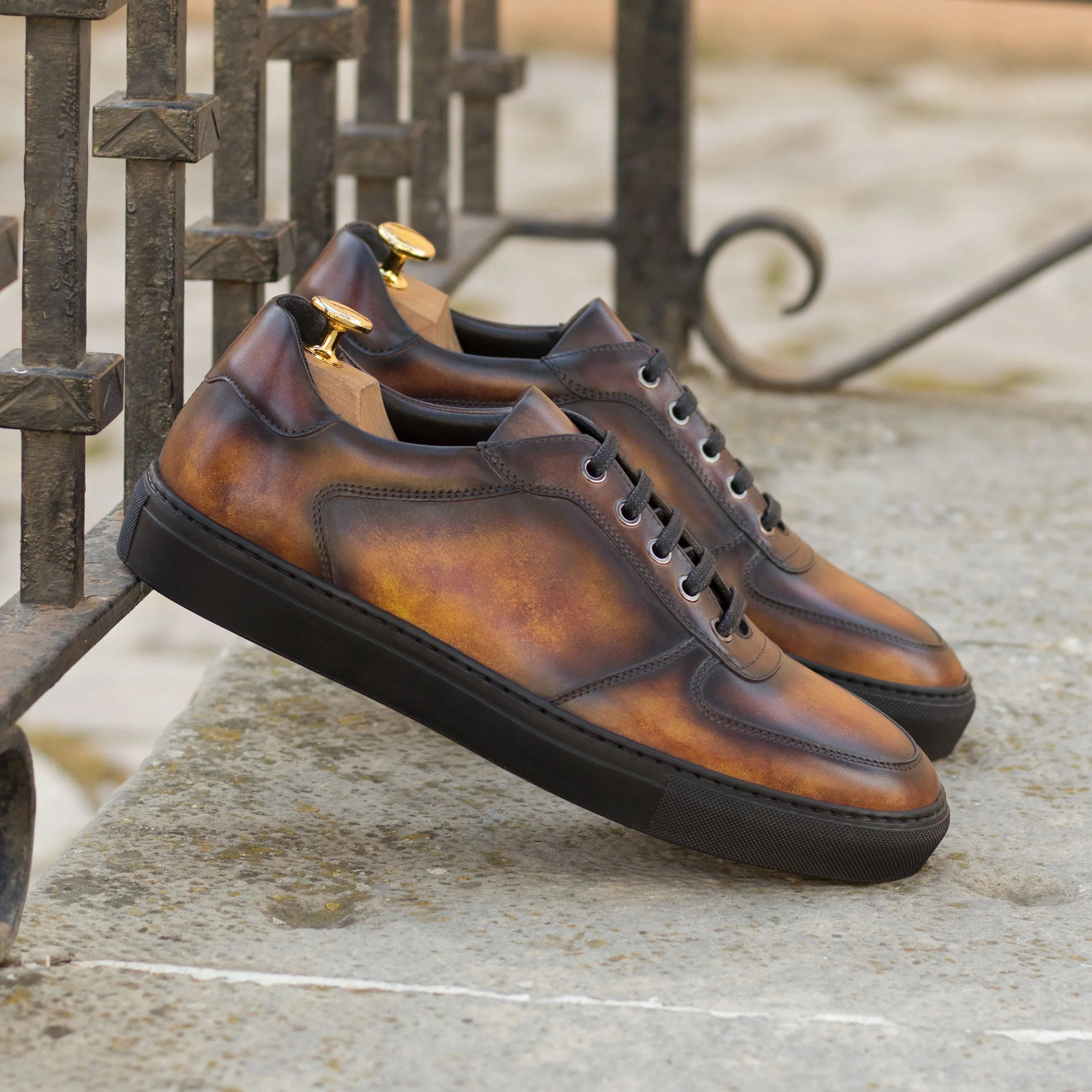 Brown leather Talsa Patina Low Top Sneaker II with black soles, stylish and versatile