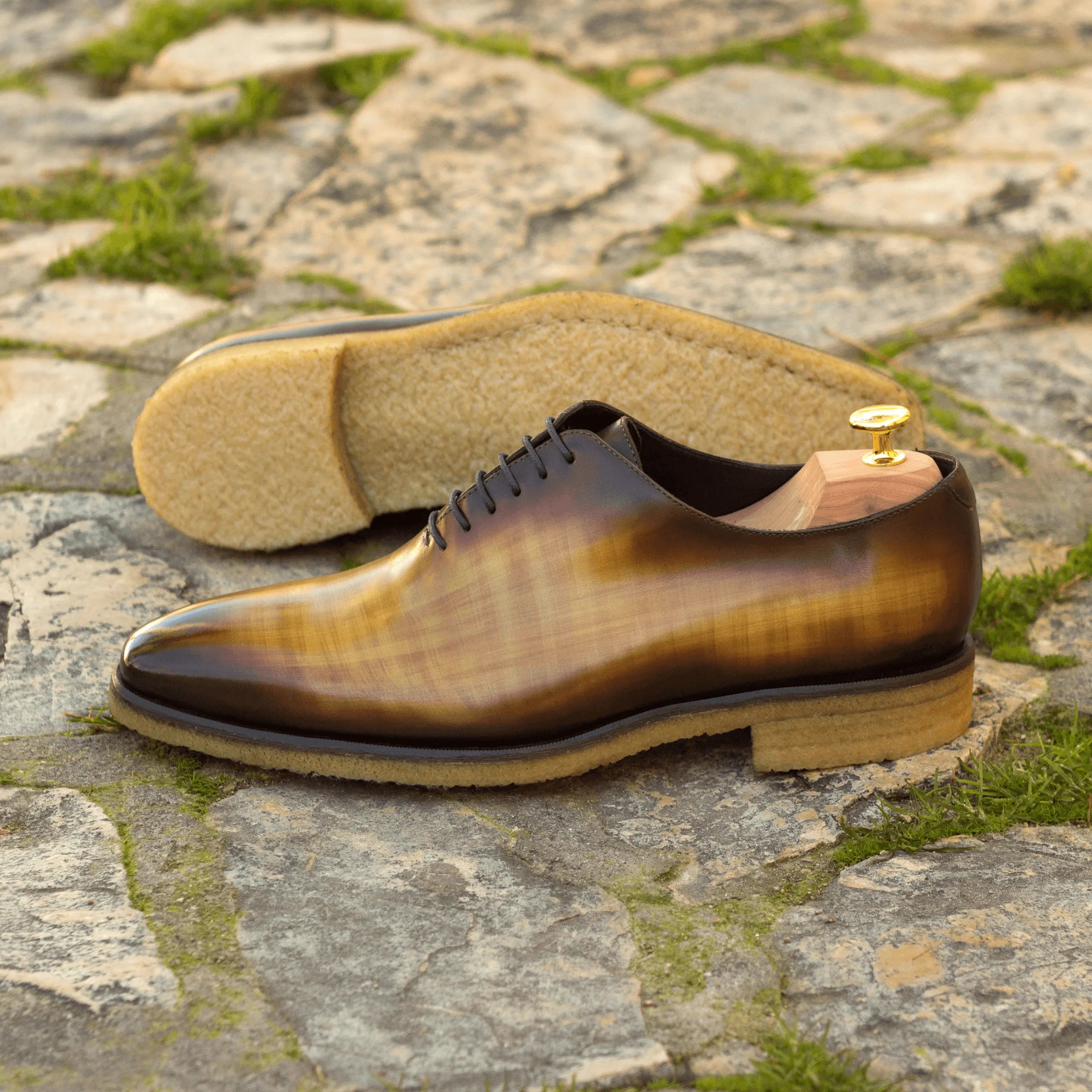 Brown leather dress shoe in the Tesla Wholecut Patina II showcasing elegant craftsmanship