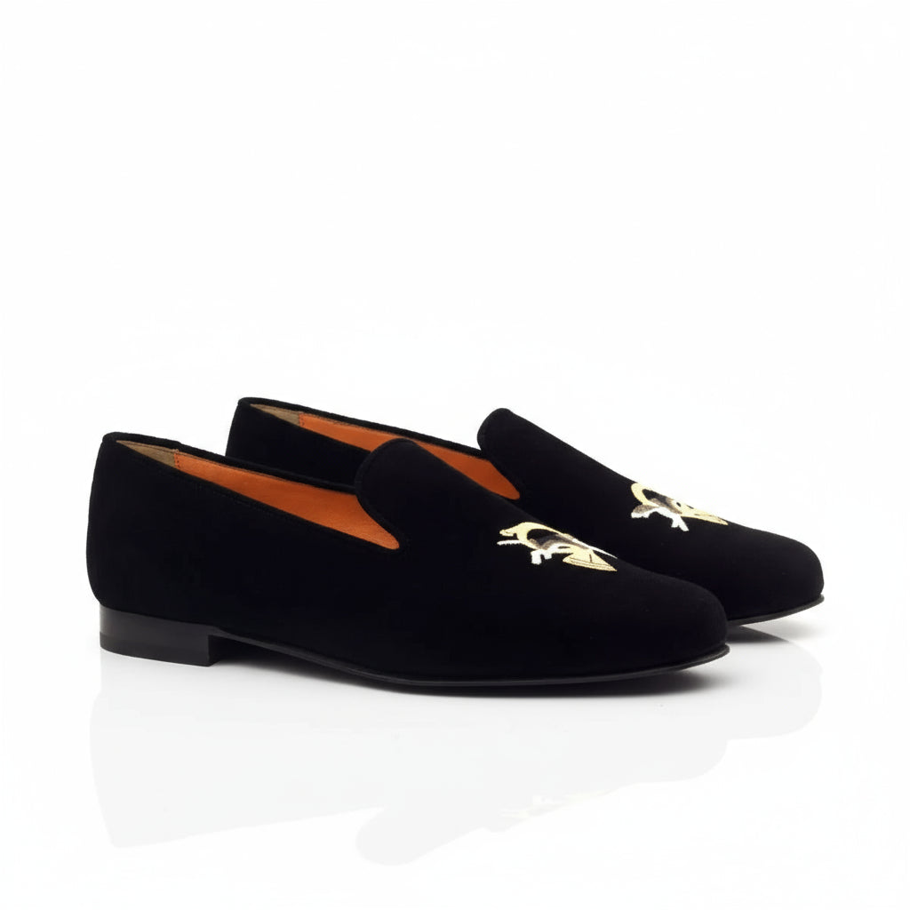 Black velvet loafers with gold embroidery from The Eye Wellington slip on collection
