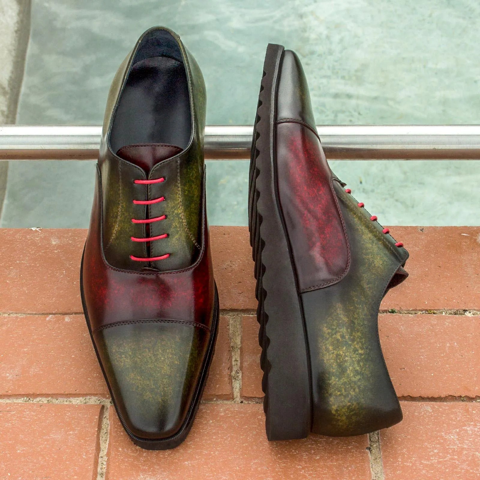 Two-toned Tice Oxford Patina shoes featuring striking red laces and elegant design