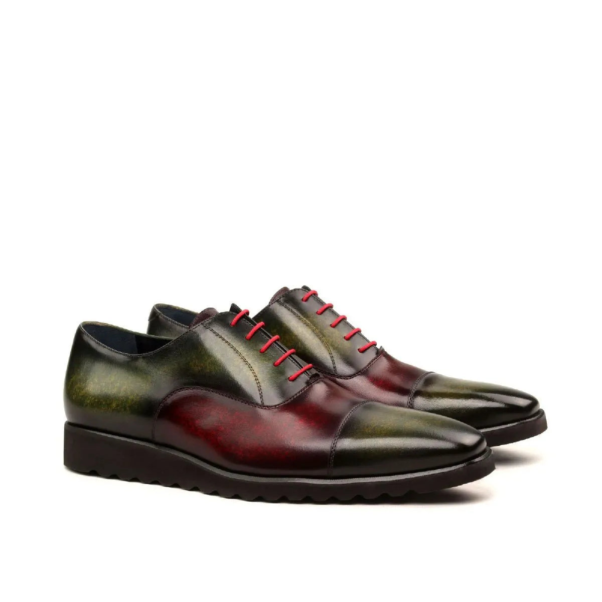 Two-toned Tice Oxford Patina shoes featuring striking red laces for a unique style