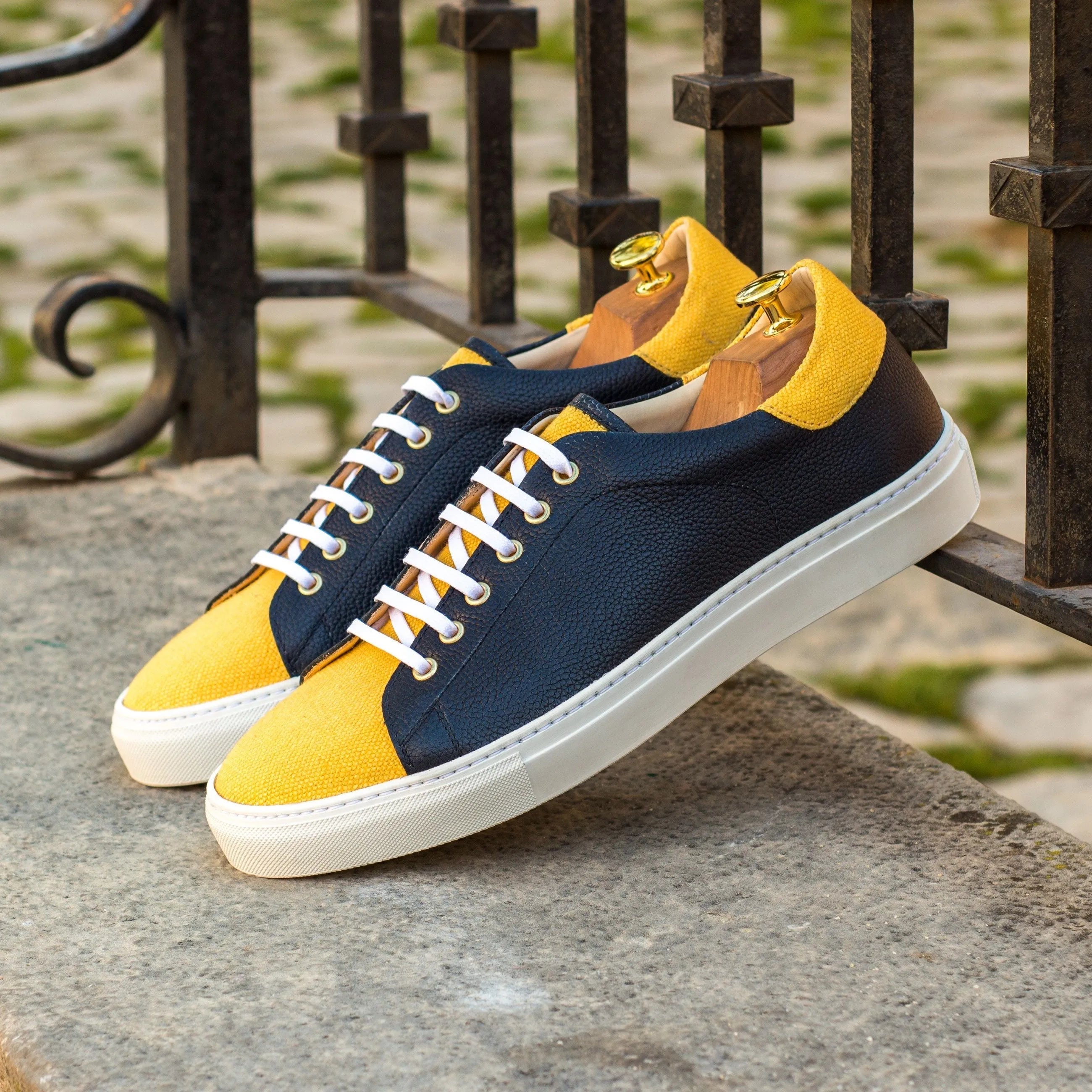 Two-toned leather sneakers featuring the Tima67 Trainer design for stylish comfort