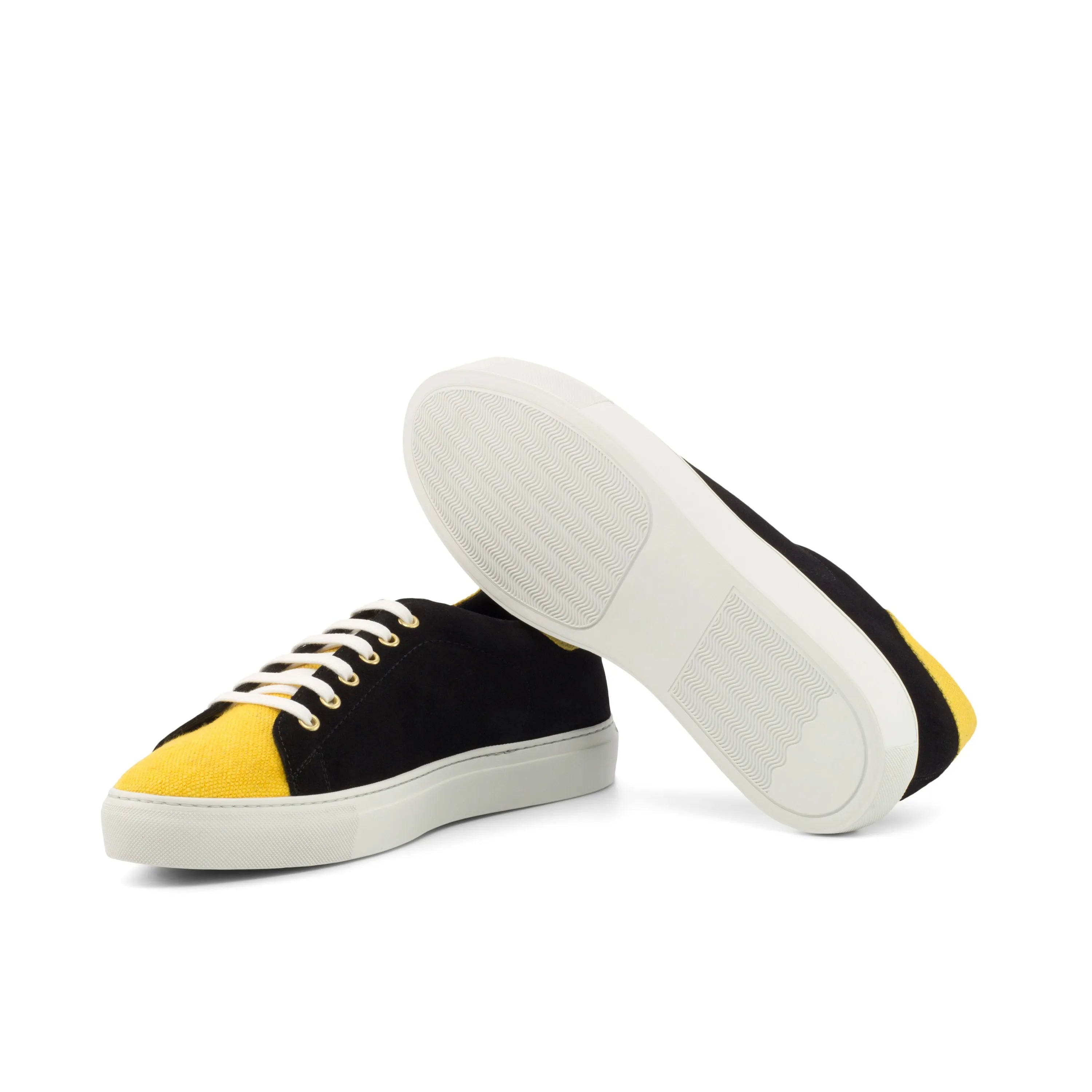 Black and yellow canvas Travis Trainer Sneakers showcasing stylish design and comfort