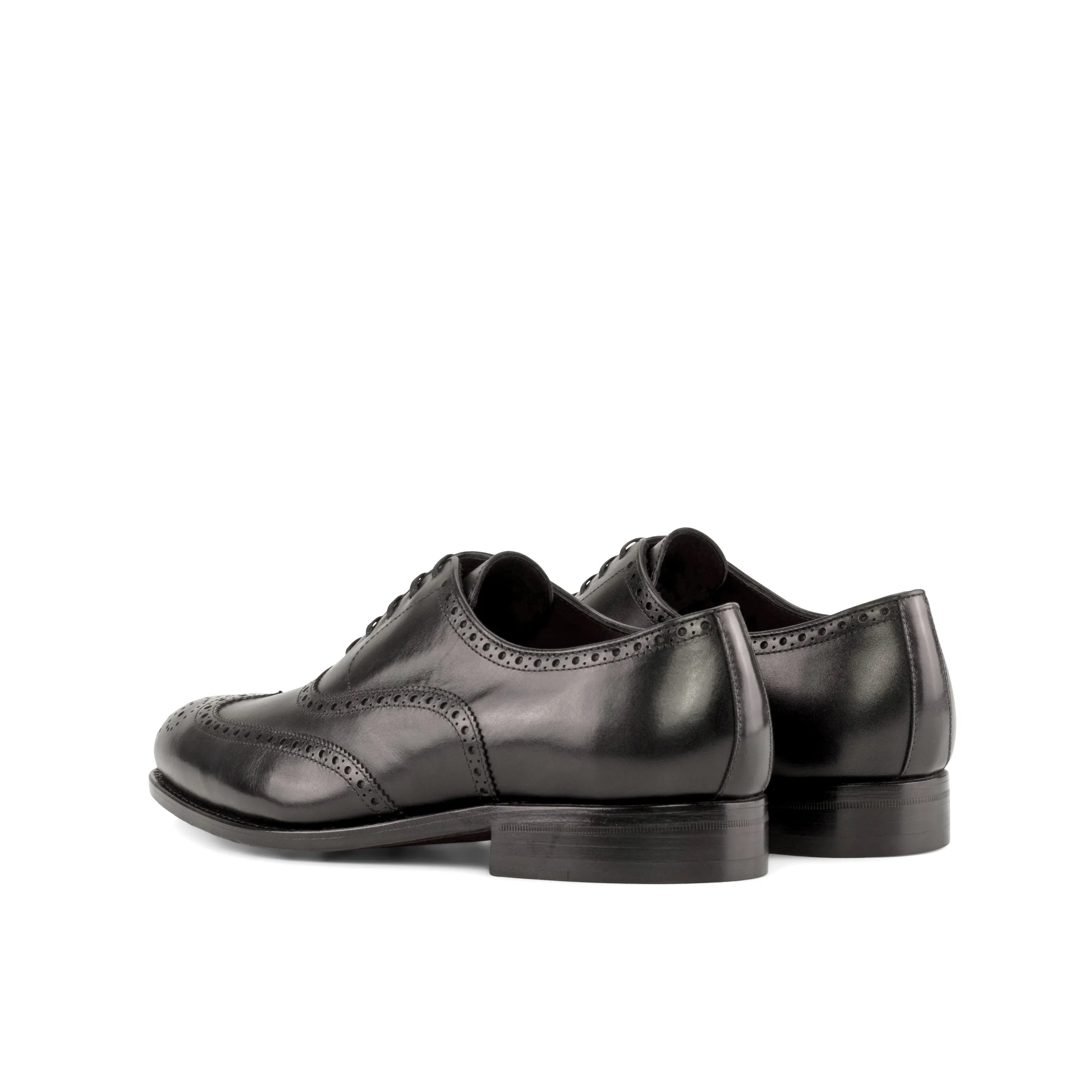 Pair of black leather wingtip dress shoes from Umberto, ideal brogue shoes for the fast lane