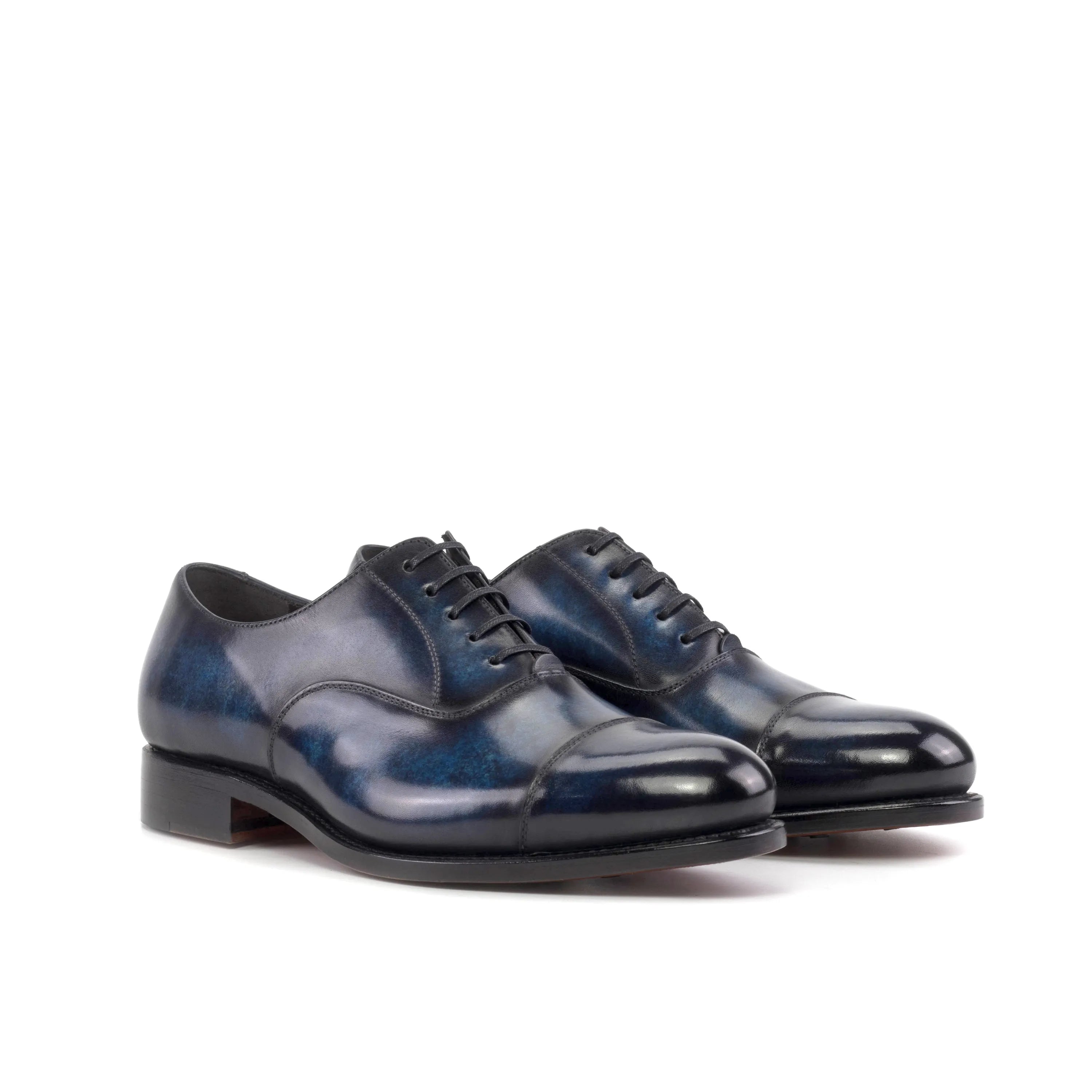 Pair of blue leather Vanguard Patina Oxford shoes showcasing elegant craftsmanship