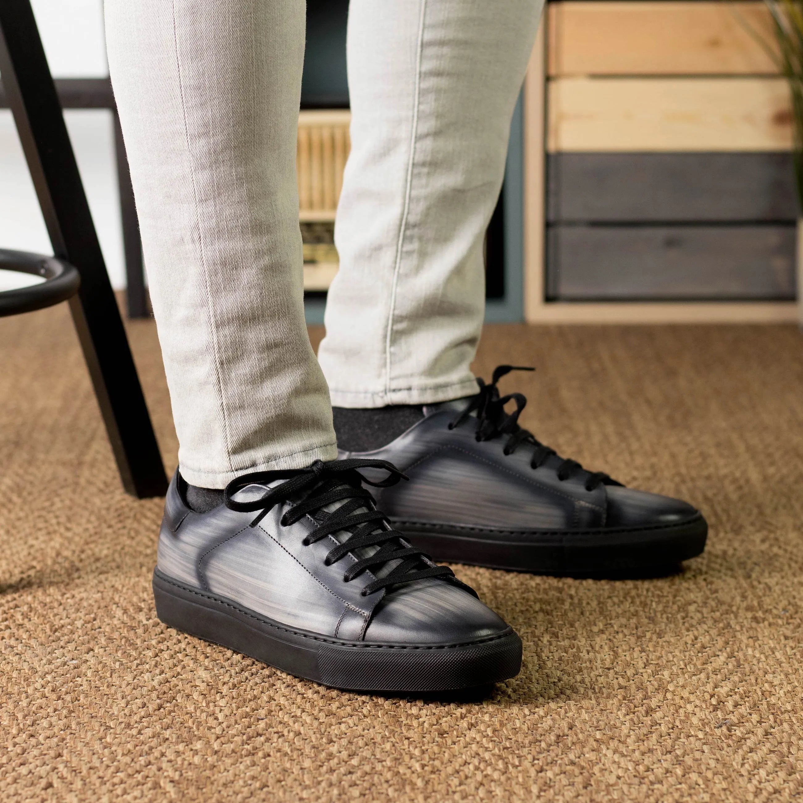 Black leather Verve Trainer Patina sneakers featuring a stylish cupsole design