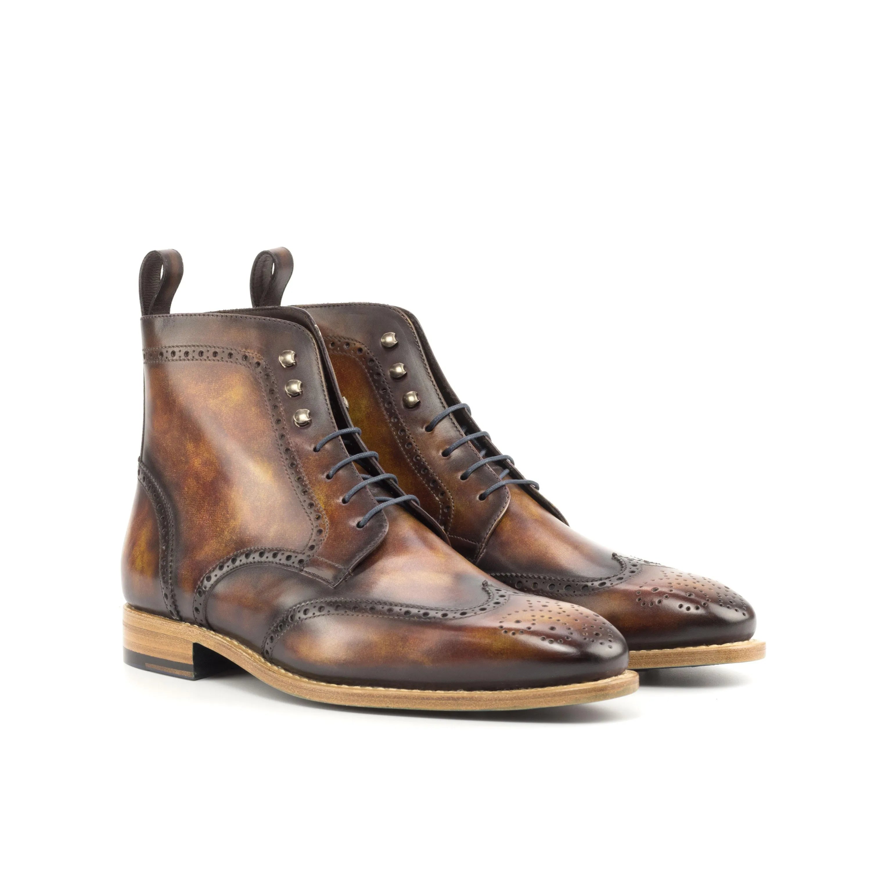 Brown leather wingtip boots featuring Wagner Military Brogue Patina design