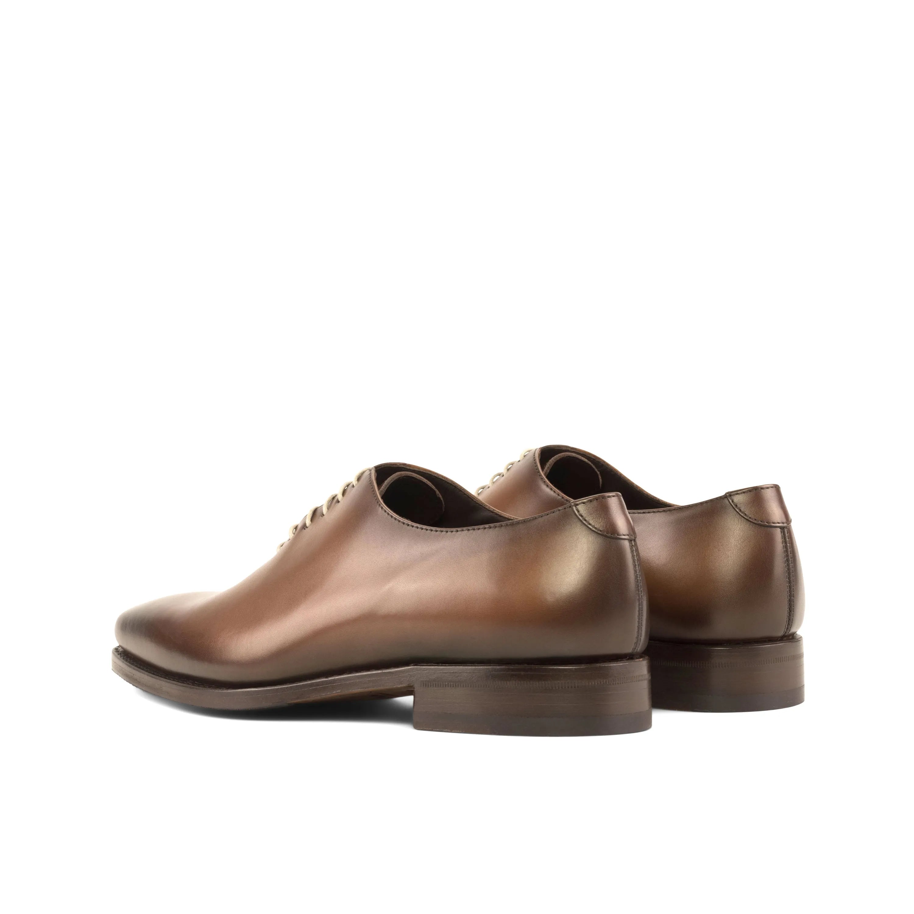 Brown leather Walker Wholecut shoes, showcasing timeless elegance and craftsmanship