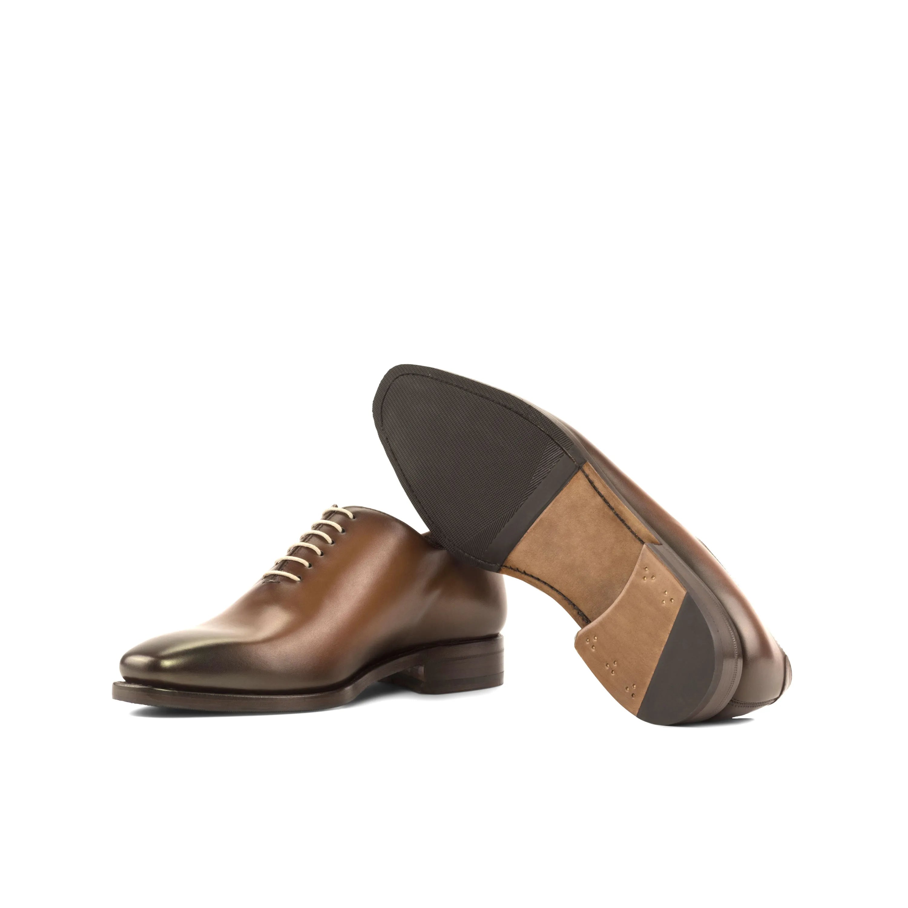 Brown leather dress shoes featuring Walker Wholecut design for elegant style