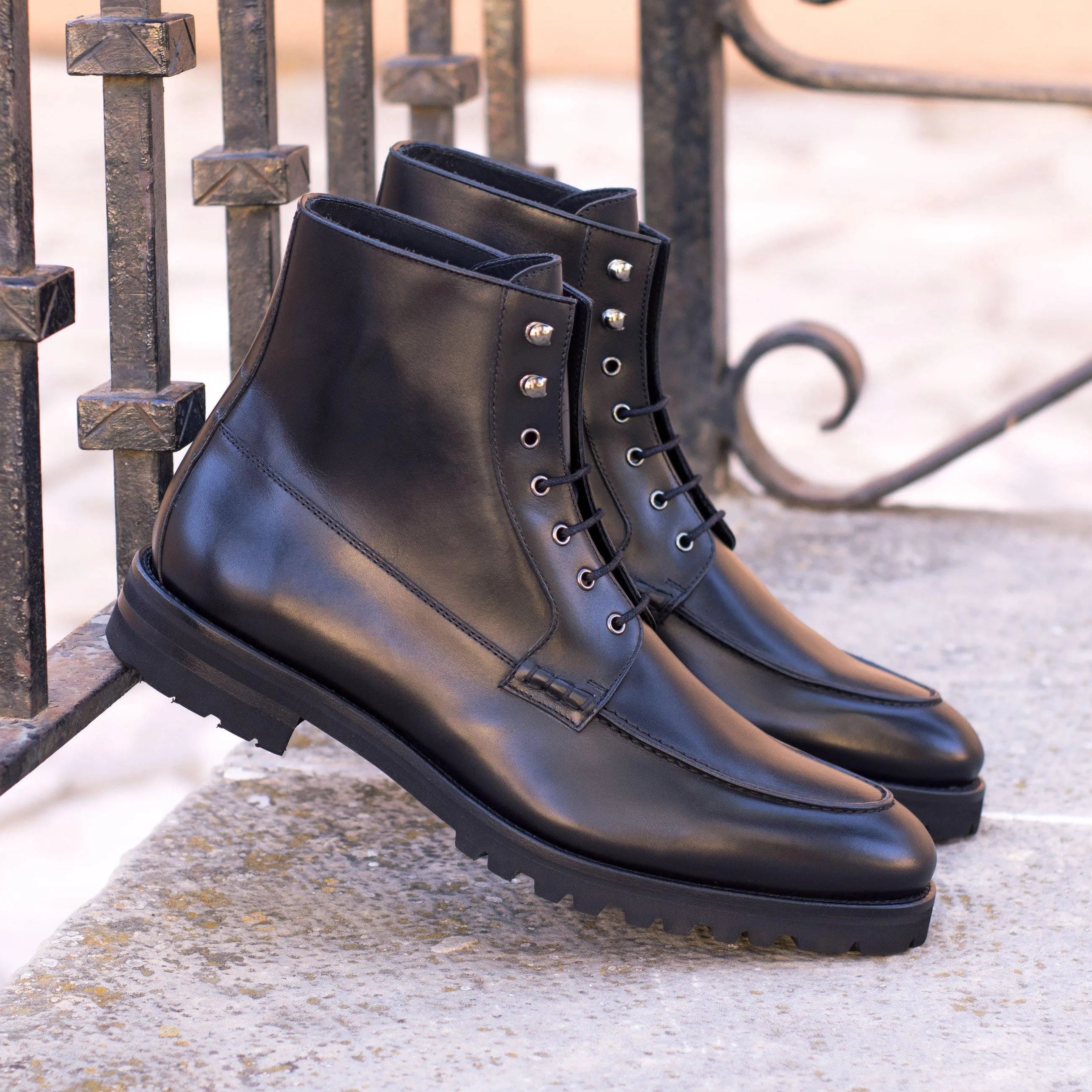 Black leather lace-up Wisconsin Moc Boots showcasing durability and style for outdoor wear