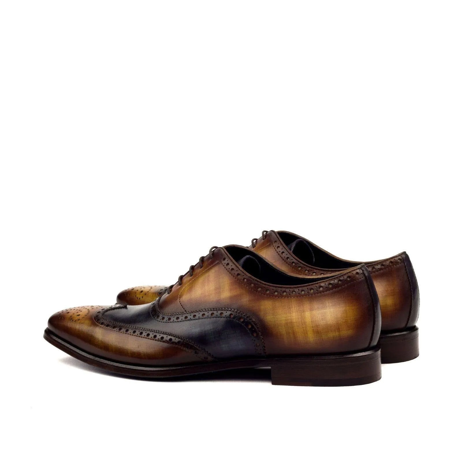 Pair of brown leather dress shoes, WT Full Brogue Patina, showcasing exquisite brogue details