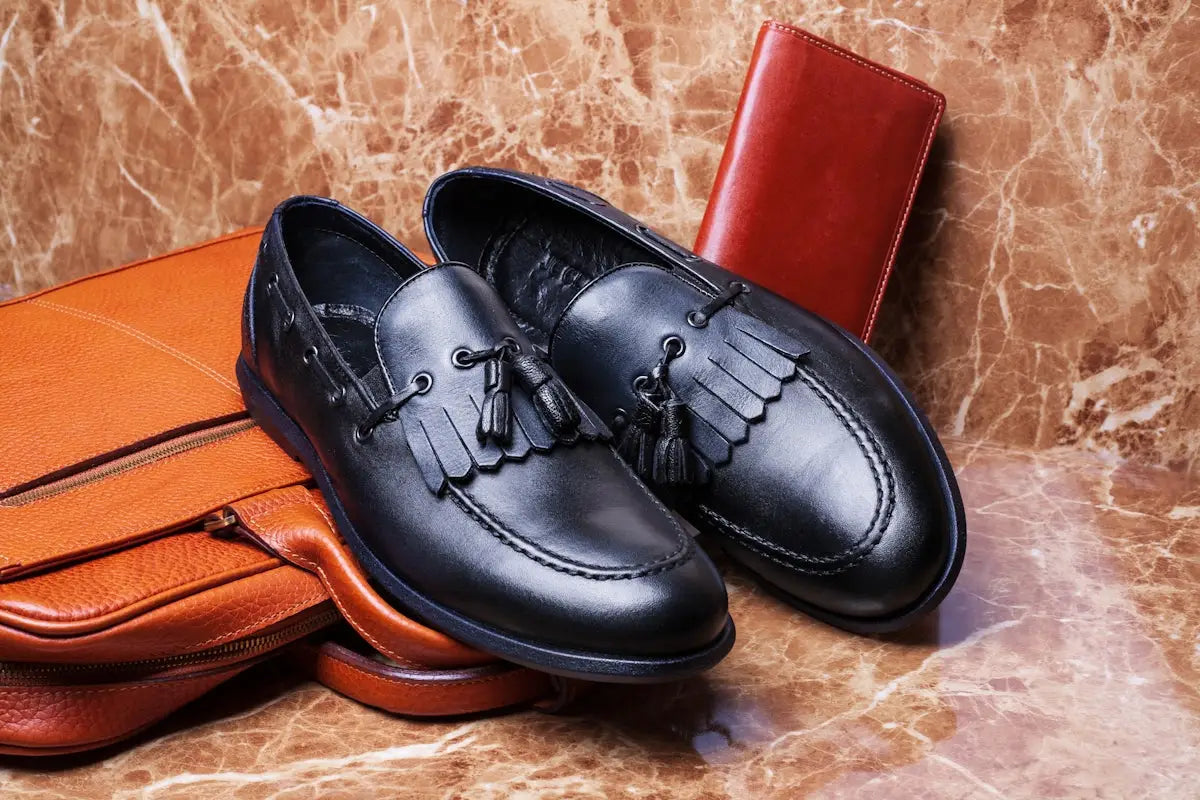 shallow focus photo of pair of black leather loafers