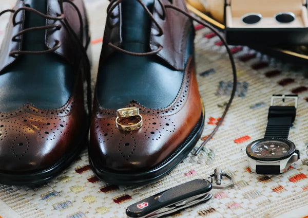 A pair of brown shoes sitting on top of a table